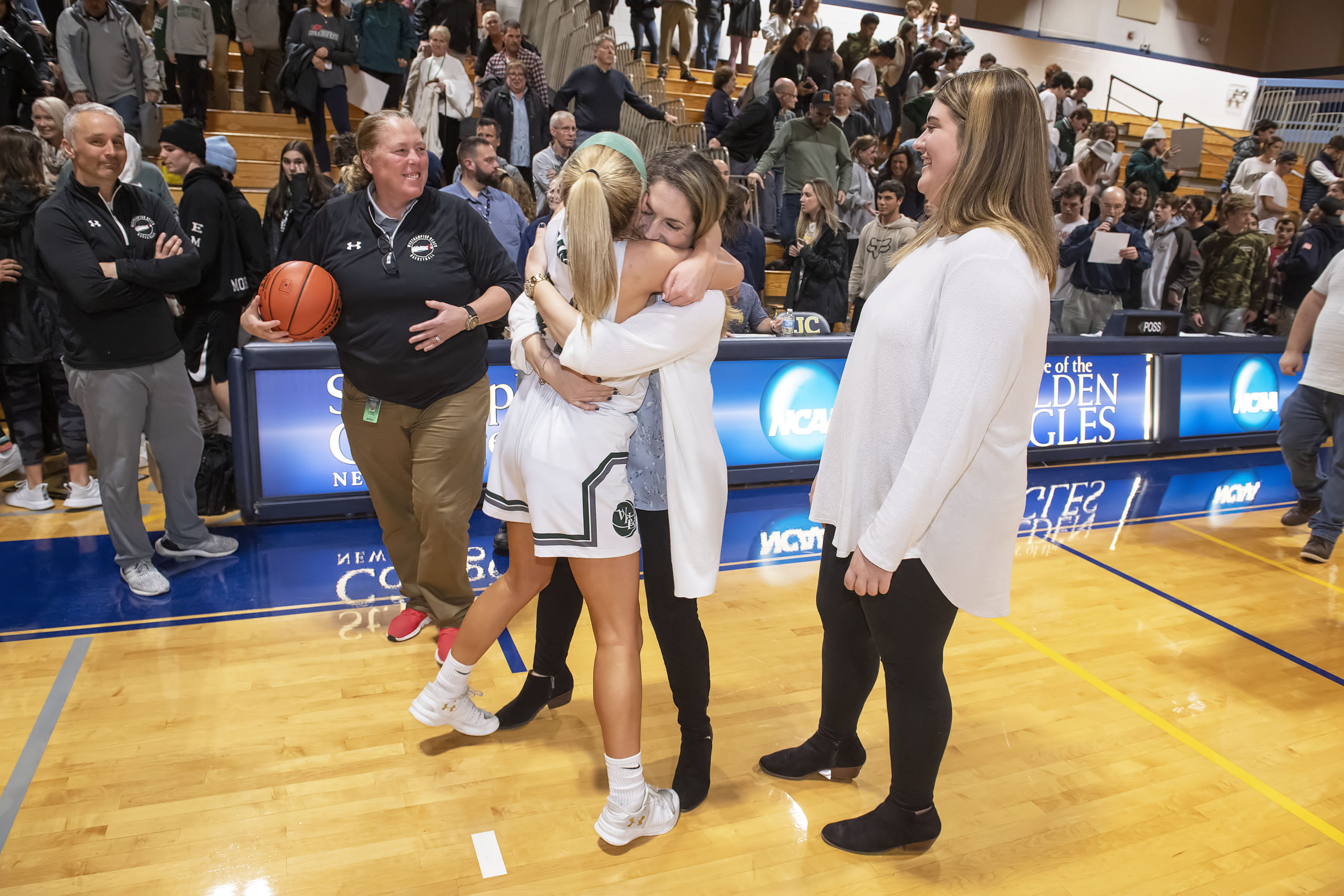 Westhampton Beach senior Isabelle Smith and head coach Katie Peters embrace each other after a hard fought victory for the county title on Tuesday night.