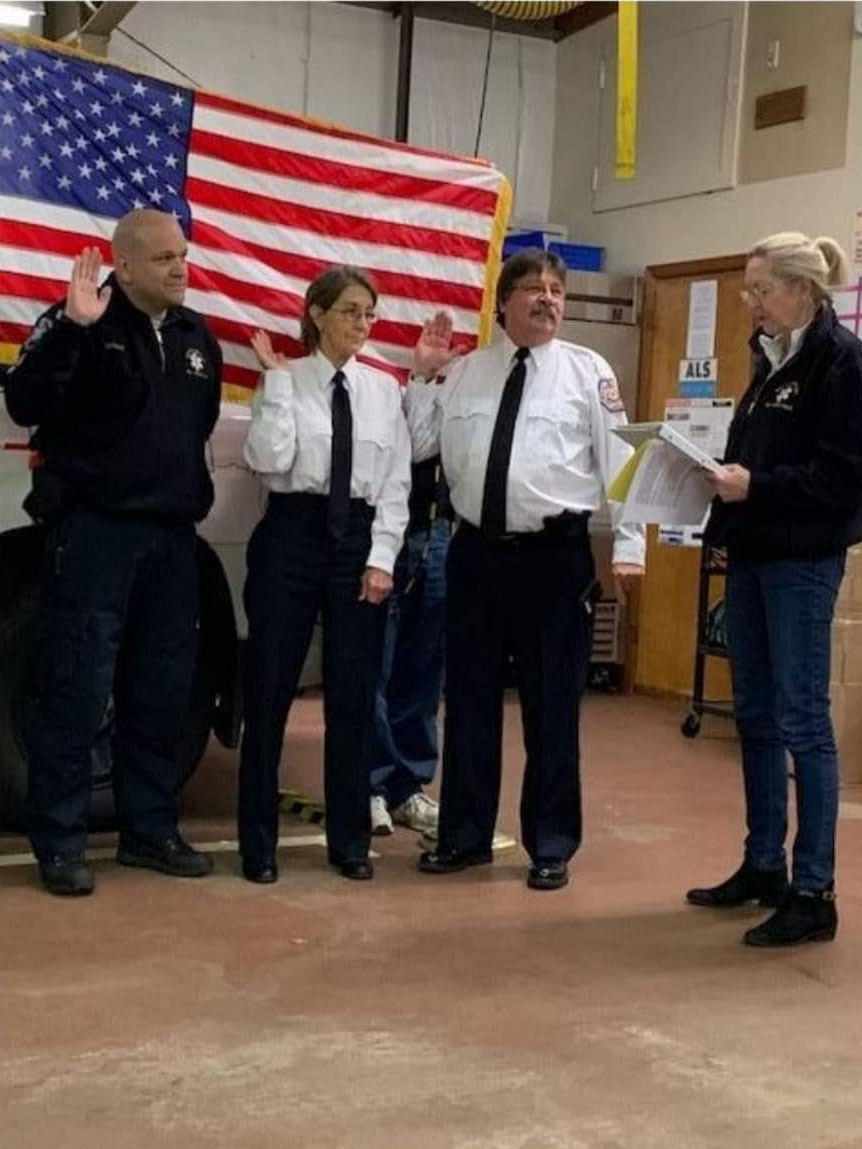Adele Kristensen, right, swears in Southampton Town Volunteer Ambulance Second Assistant Chief Guy Sparks, First Assistant Chief Linda Forster and Chief Tom Nanos.
