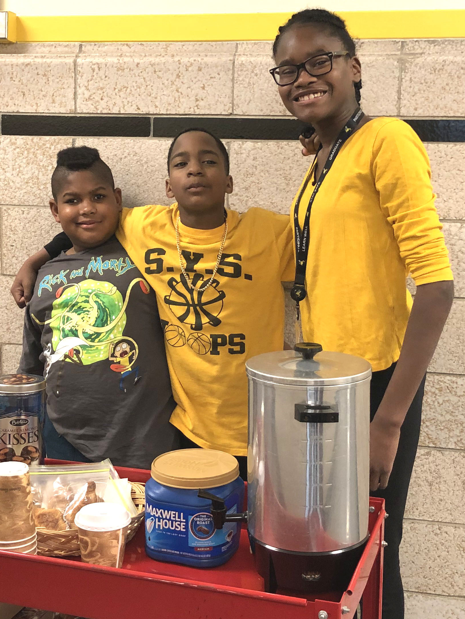 Nigel Abercrombie, Marques Thomas and MaKayla Pinckney serve up goodies from the school's Honey Hive Cafe. 