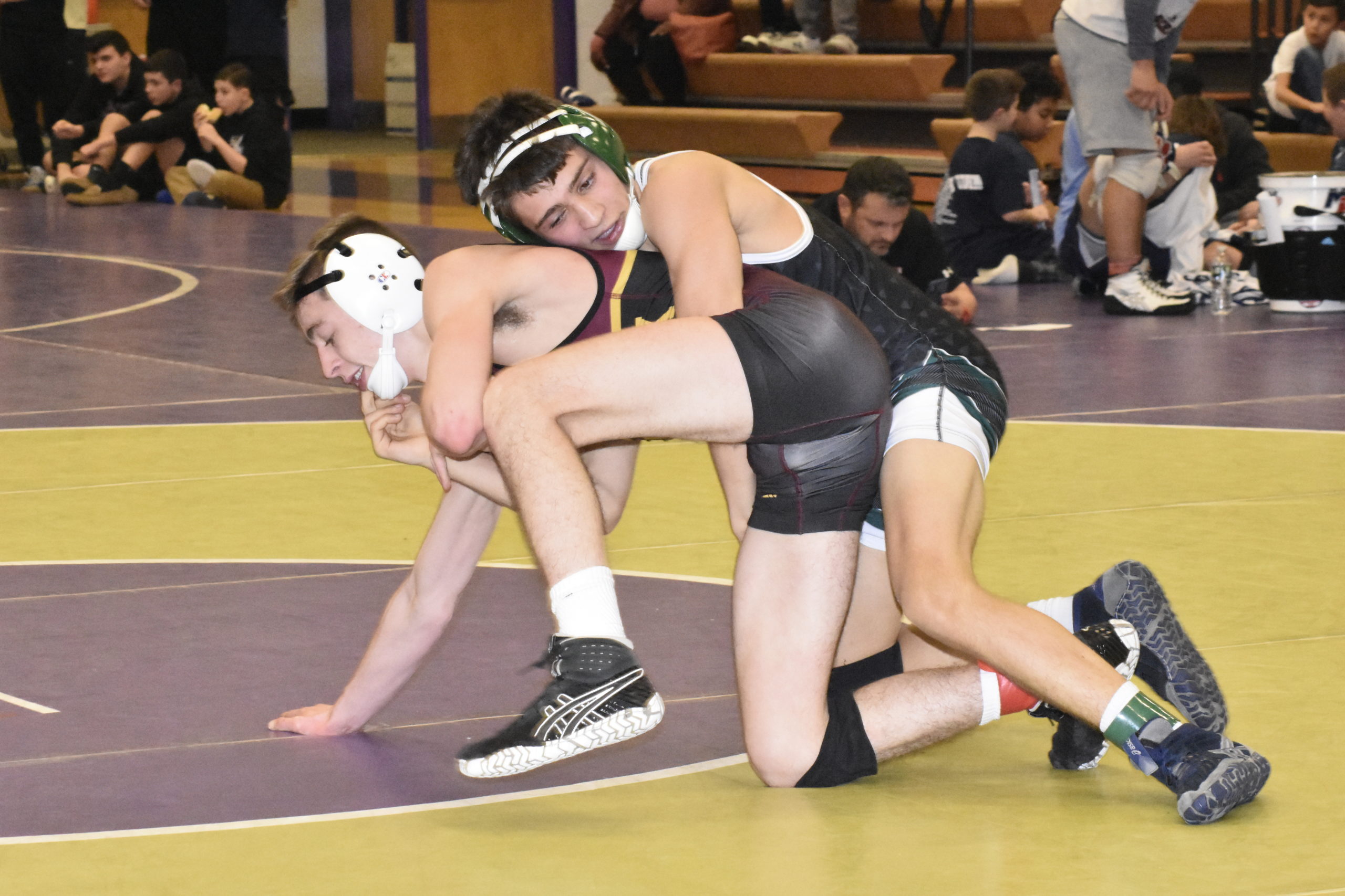 Westhampton Beach junior Jack Santora battles with Harry Wiwczar of Kings Park in the consolation final.