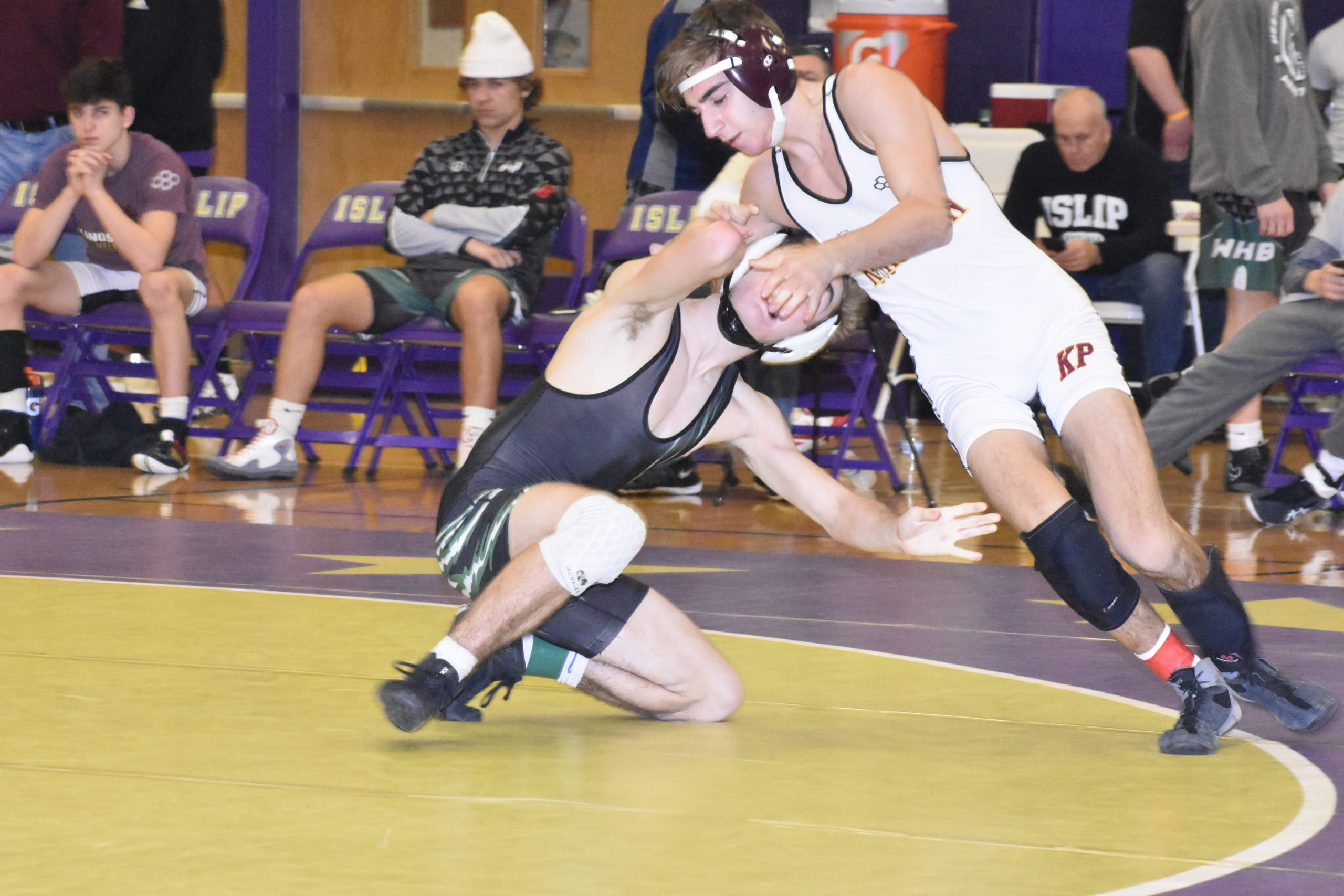 Westhampton Beach junior Grant Skala looks for an opening on Vincent Ziccardi of Kings Park in their finals match.