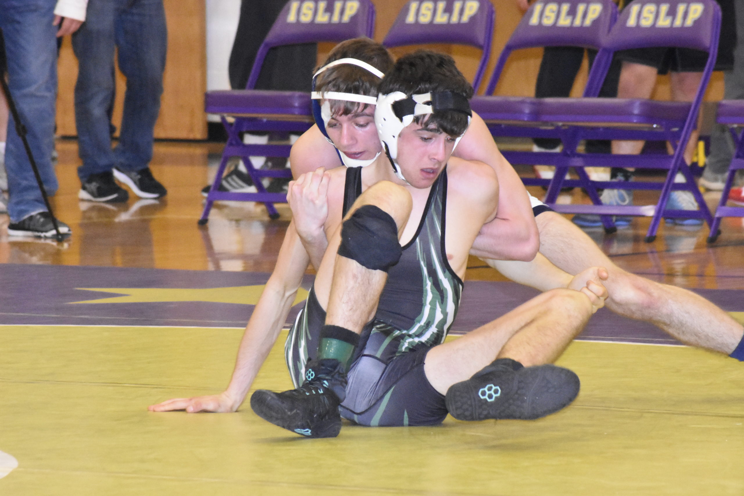 Westhampton Beach junior Will Zaffuto tries to get out of the grasp of Miller Place's Mark Rado.