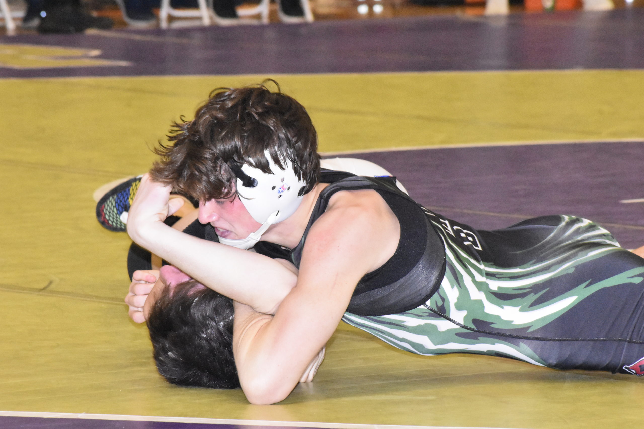 Westhampton Beach senior Jason Montagna flipped Thomas DiResta of Kings Park to his back and nearly pinned him in the first period of their finals match.