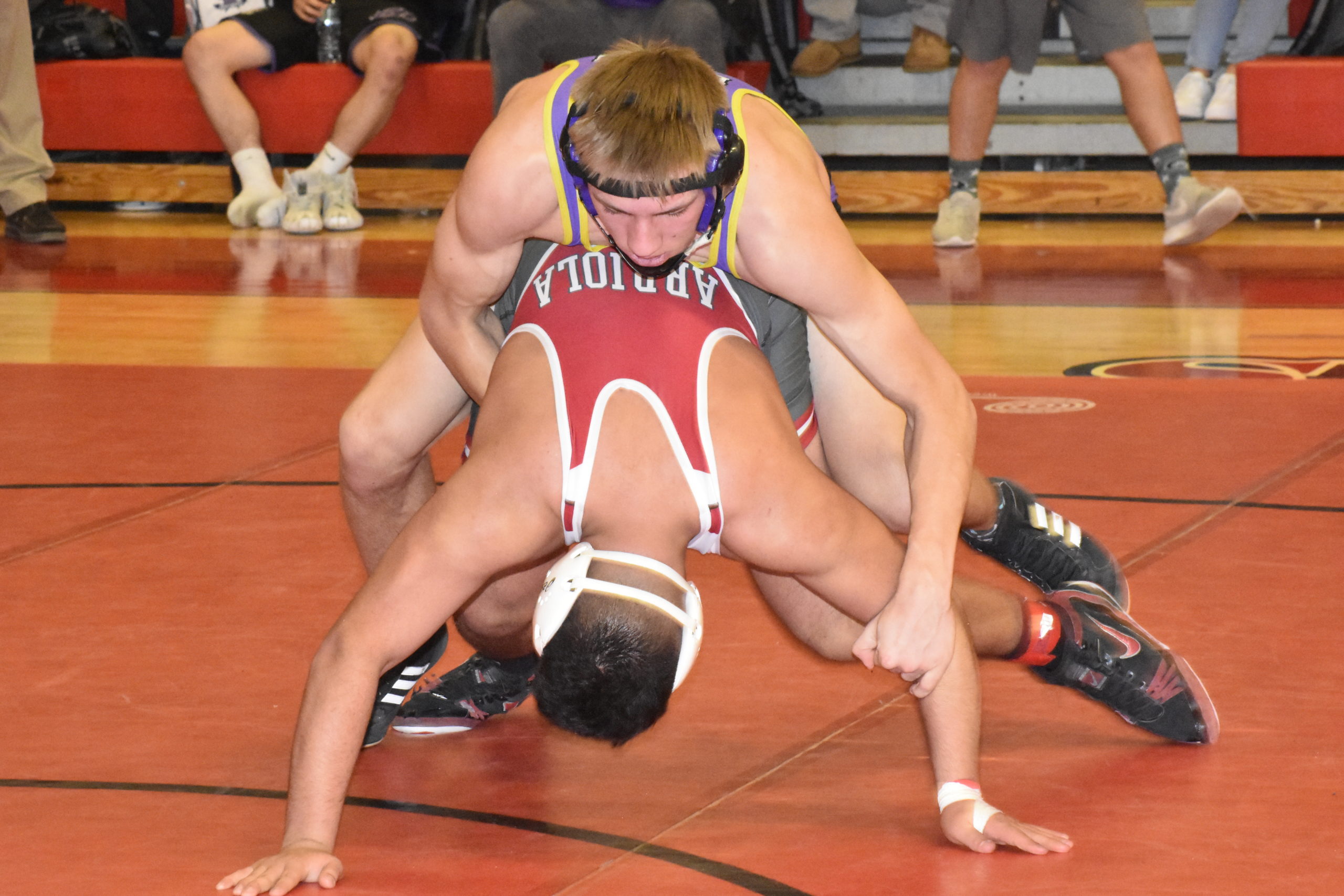 Will Krivickas of Hampton Bays gets behind Marcos Arriola of Center Moriches to score and win in sudden victory in the consolation final.