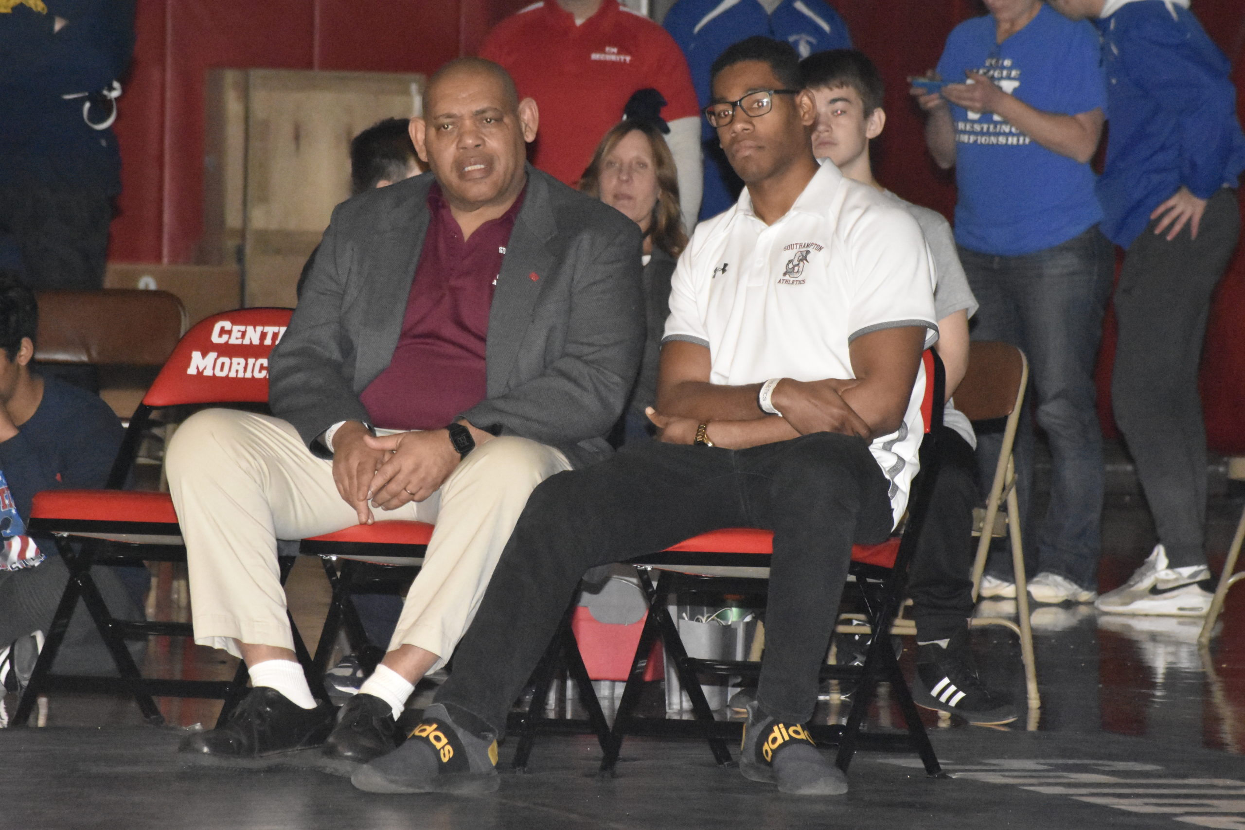 Southampton head coach Lester Ware, left, and assistant Komari Moses watch Ben Brown in the county final.
