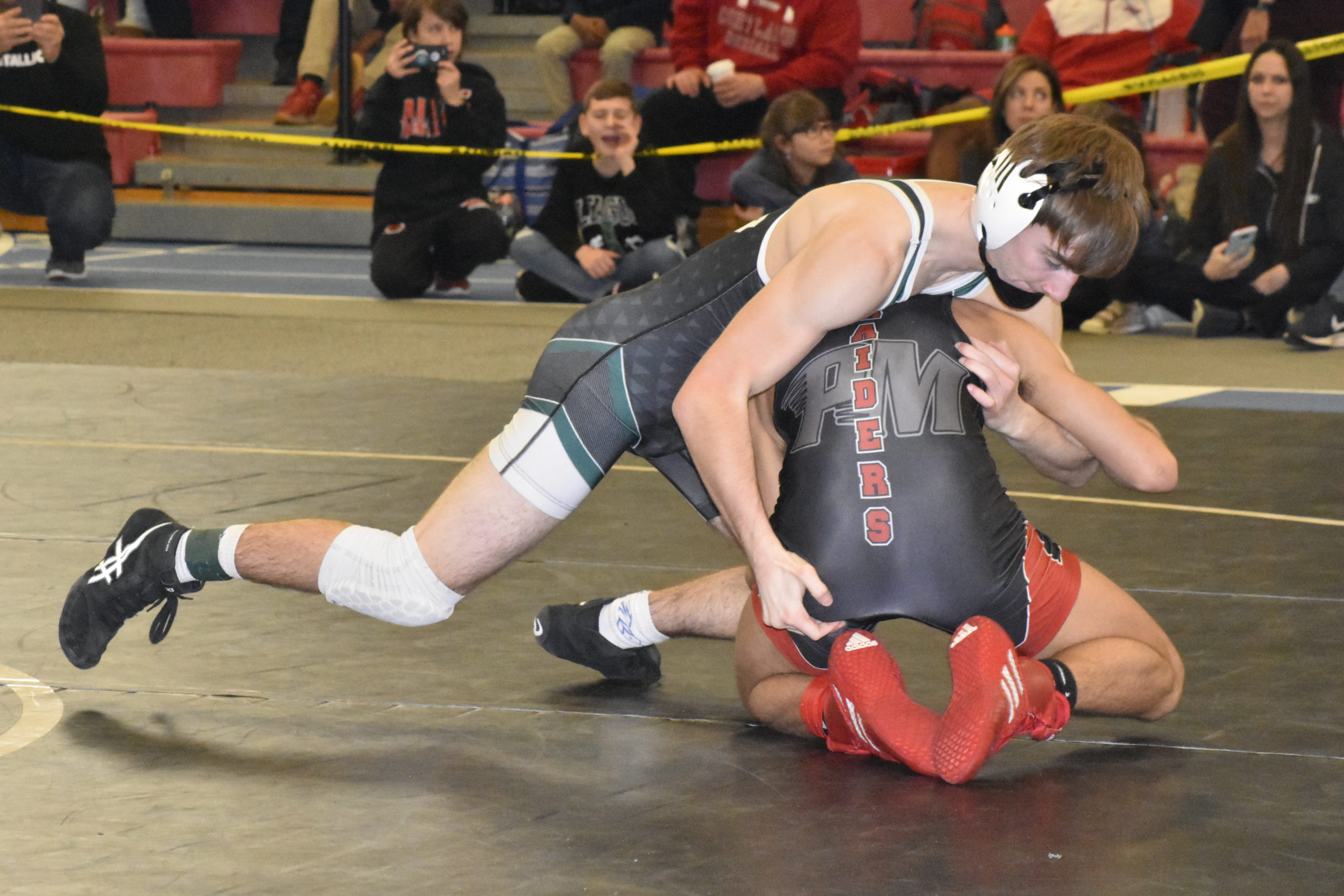 Westhampton Beach junior Grant Skala works with Patchogue/Medford's Anthony Spataro.