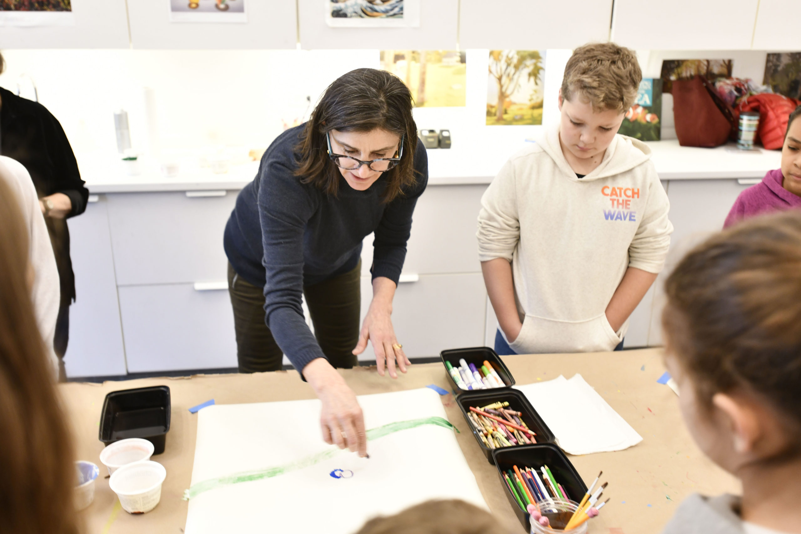 Artist Irina Alimanestianu works with students from the Tuckahoe School's 4th grade classes at the Parrish Art Museum. DANA SHAW