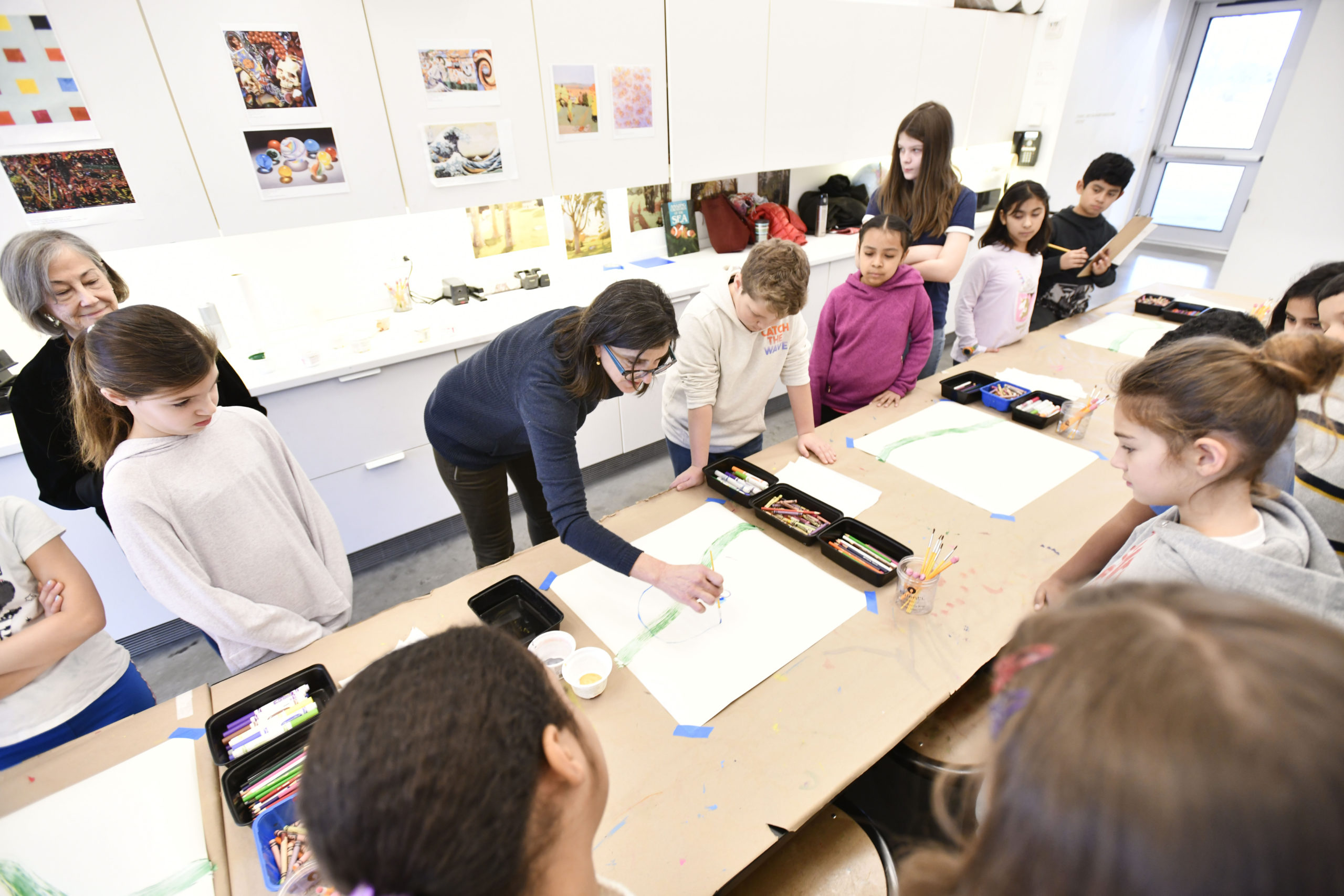 Artist Irina Alimanestianu works with students from the Tuckahoe School's 4th grade classes at the Parrish Art Museum. DANA SHAW