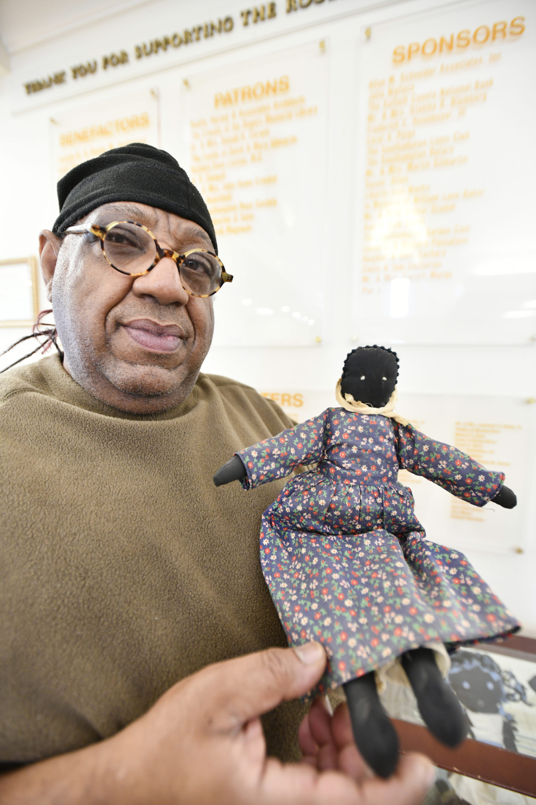 Samuel Johnson with one of the oldest dolls in his collection. DANA SHAW