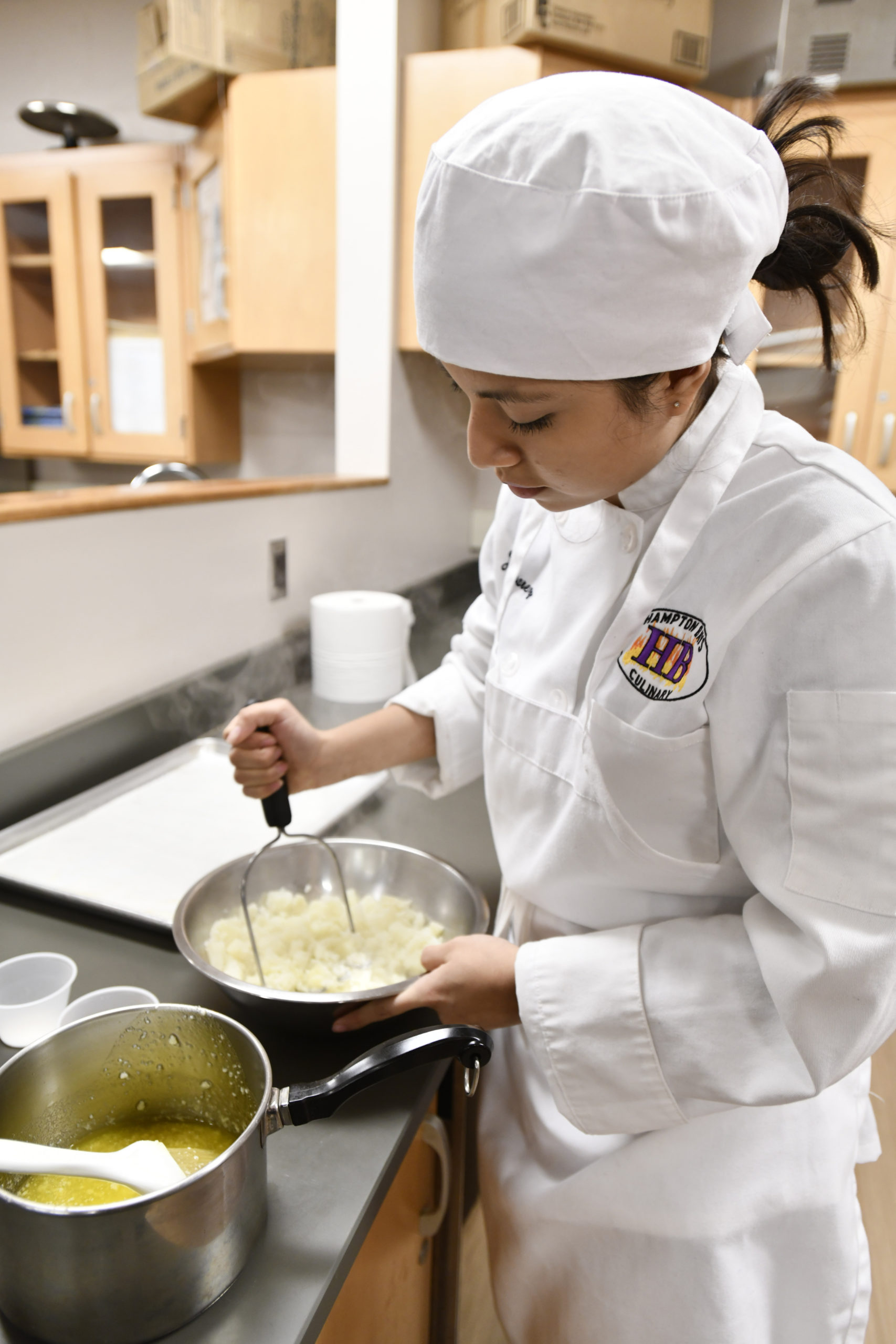 Student Juliana Alvarez works on and assignment during the culinary class at Hampton Bays High School. DANA SHAW