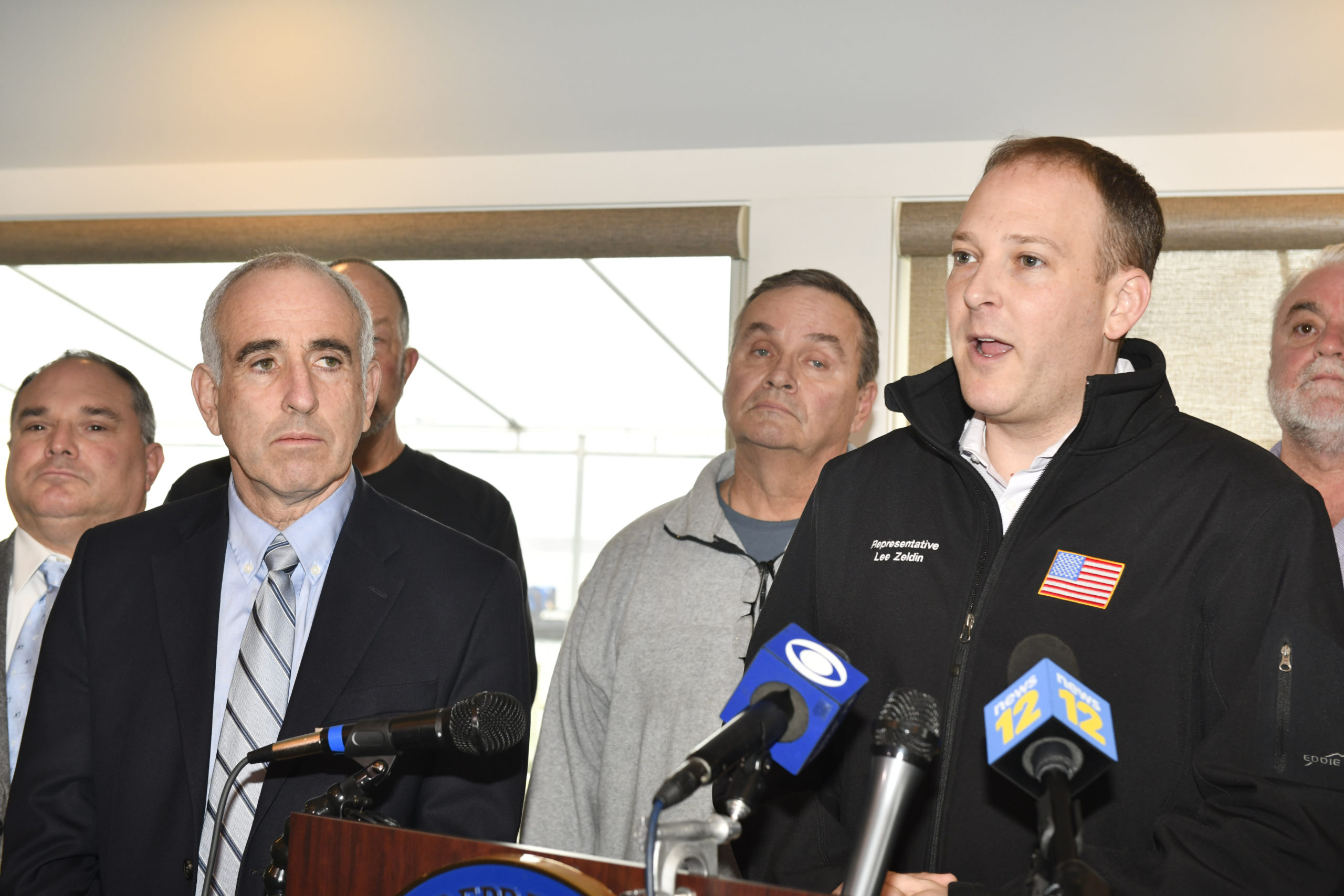 Southampton Town Supervisor Jay Schneiderman looks on as U.S. Representative Lee Zeldin announces the start of the dredge of Shinnecock Inlet and placement of an estimated 600,000 cubic yards of sand just west of the inlet at a press cenference at Sundays On the Bay in Hampton Bays on Monday morning.    DANA SHAW