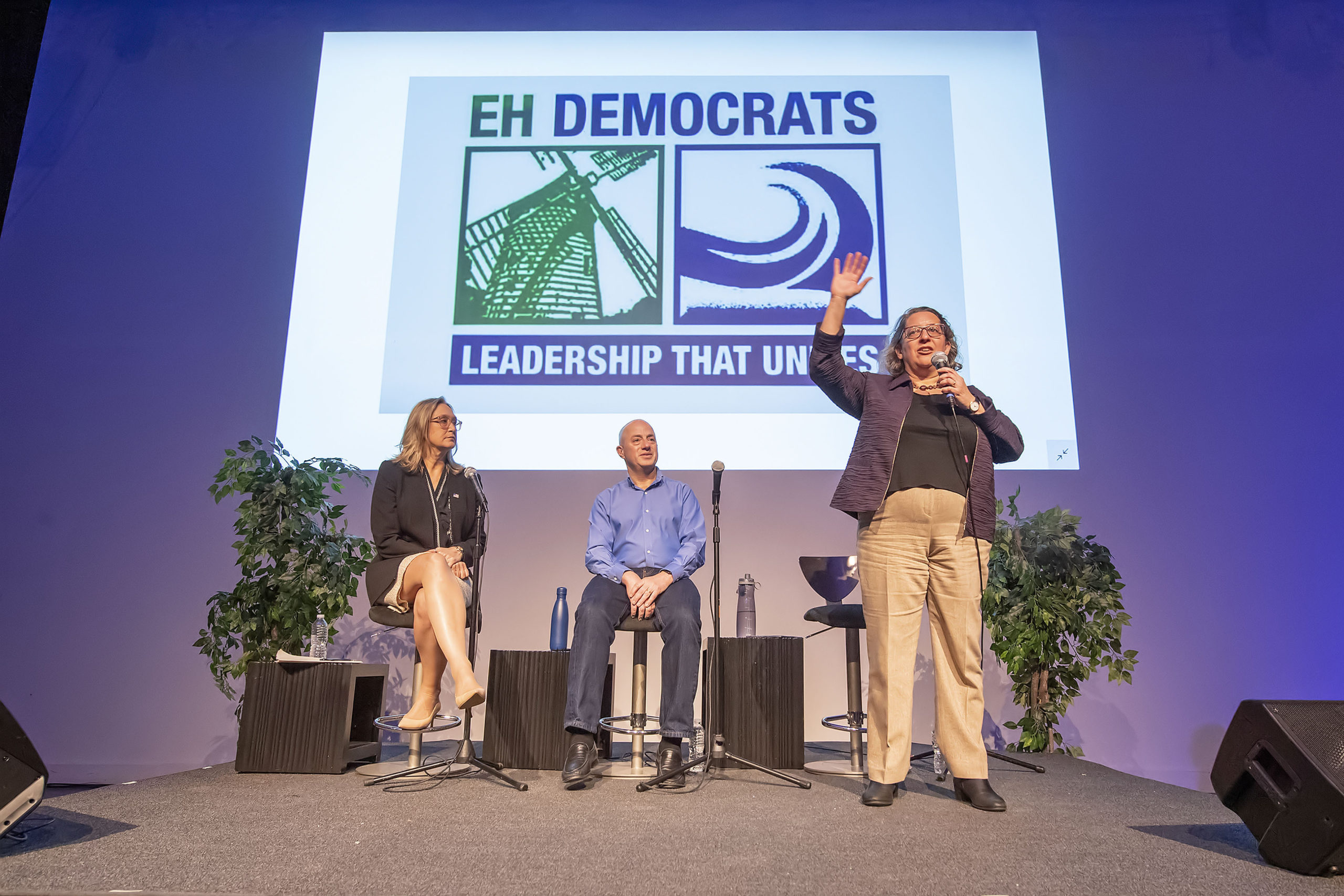 Nancy Goroff speaks as Bridget Fleming and Perry Gershon look on during a forum of democratic candidates for the 1st Congressional District at LTV Studios on Monday night.    MICHAEL HELLER