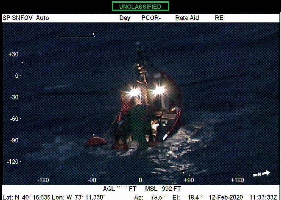 The partially submerged New Age as seen from a U.S. Coast Guard rescue helicopter. COURTESY U.S. COAST GUARD