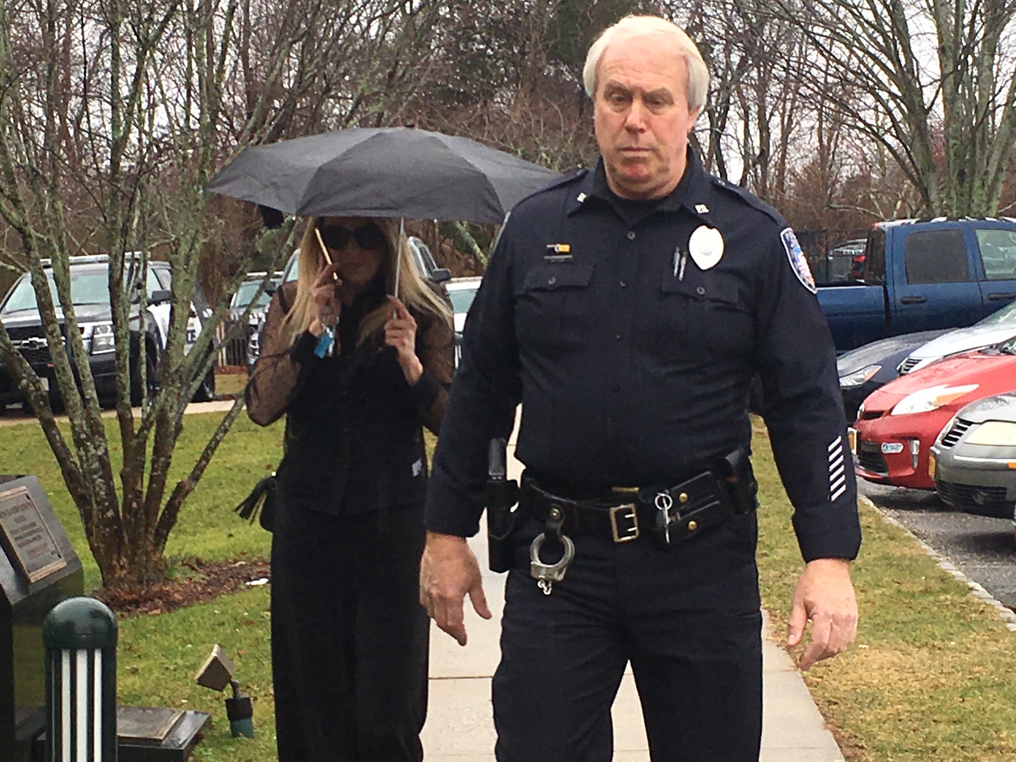 Kate Lohan is escorted into court in Southampton Village. KITTY MERRILL