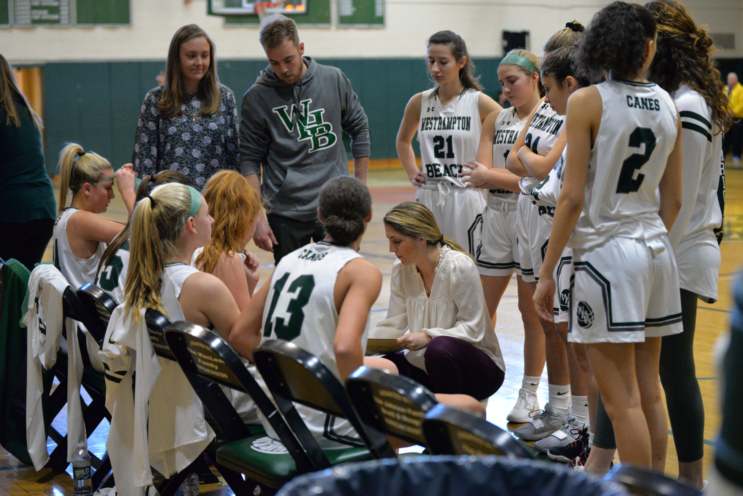 Westhampton Beach head coach Katie Peters goes over some strategy with her players during a time out.