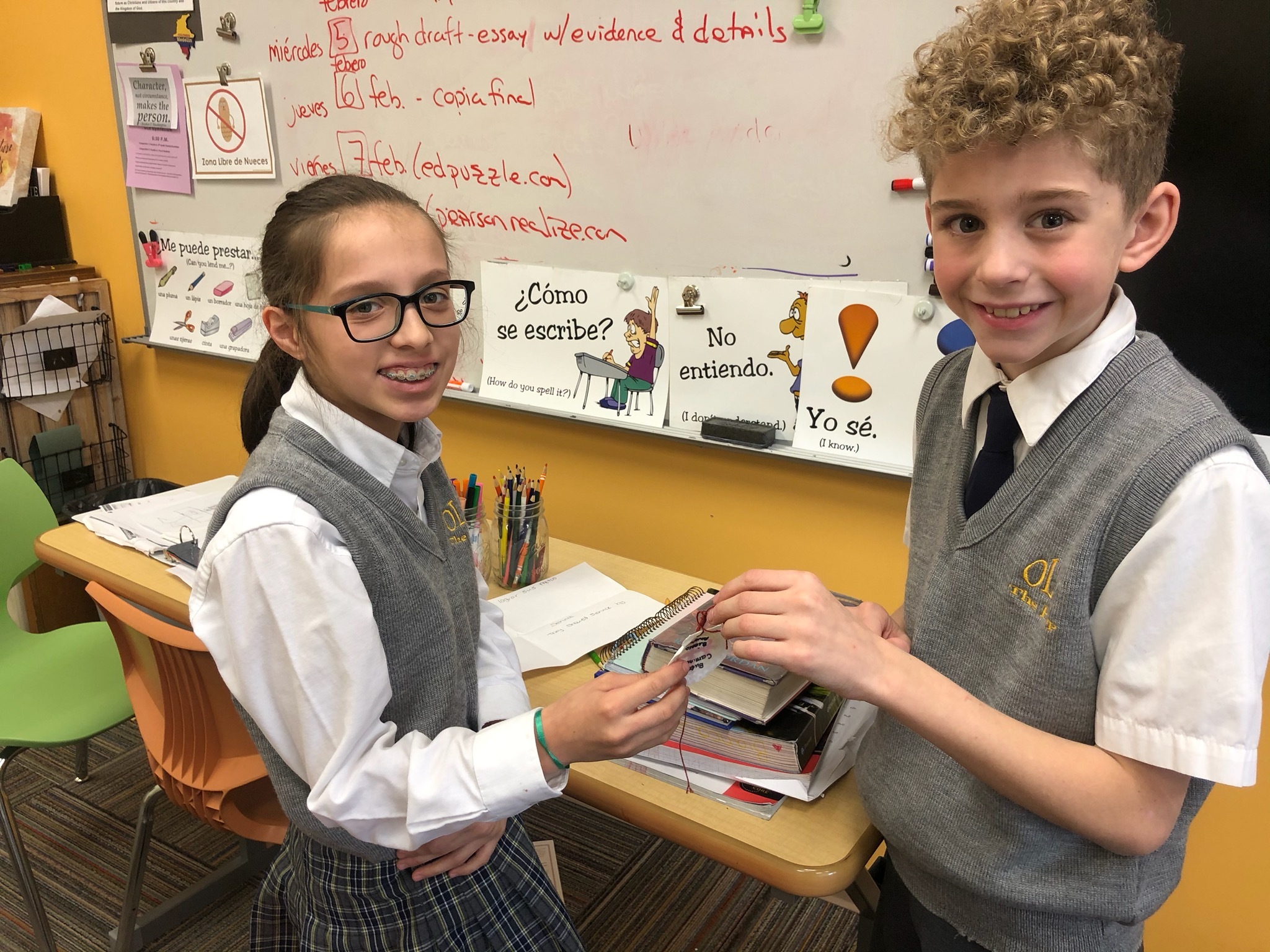 Our Lady of the Hamptons School sixth-graders Bianca Alvarado and Brian Spellman helped to prepare the identification shells for the pilgrimage project. The mock pilgramage is the culmination of an integrated Spanish, religion, art, history, and geography project.