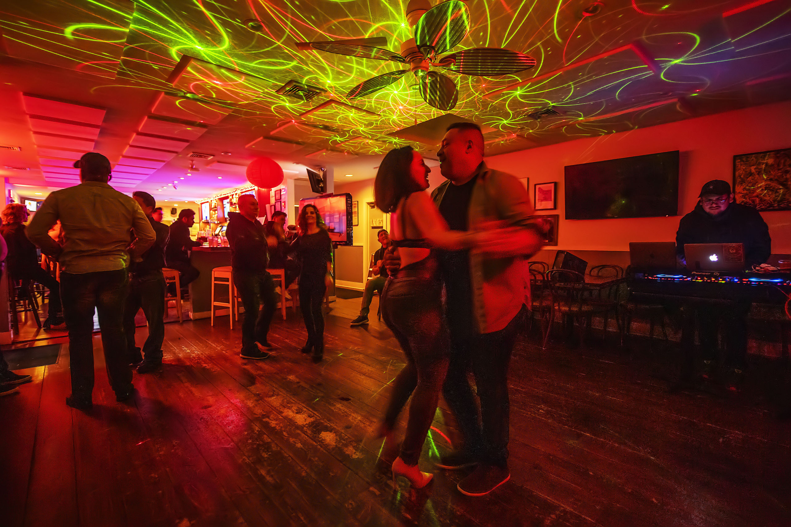 Supporters of ProjectMost on the dance floor during a Salsa Dance Party  at the Springs Tavern on Saturday night, January 25. MICHAEL HELLER