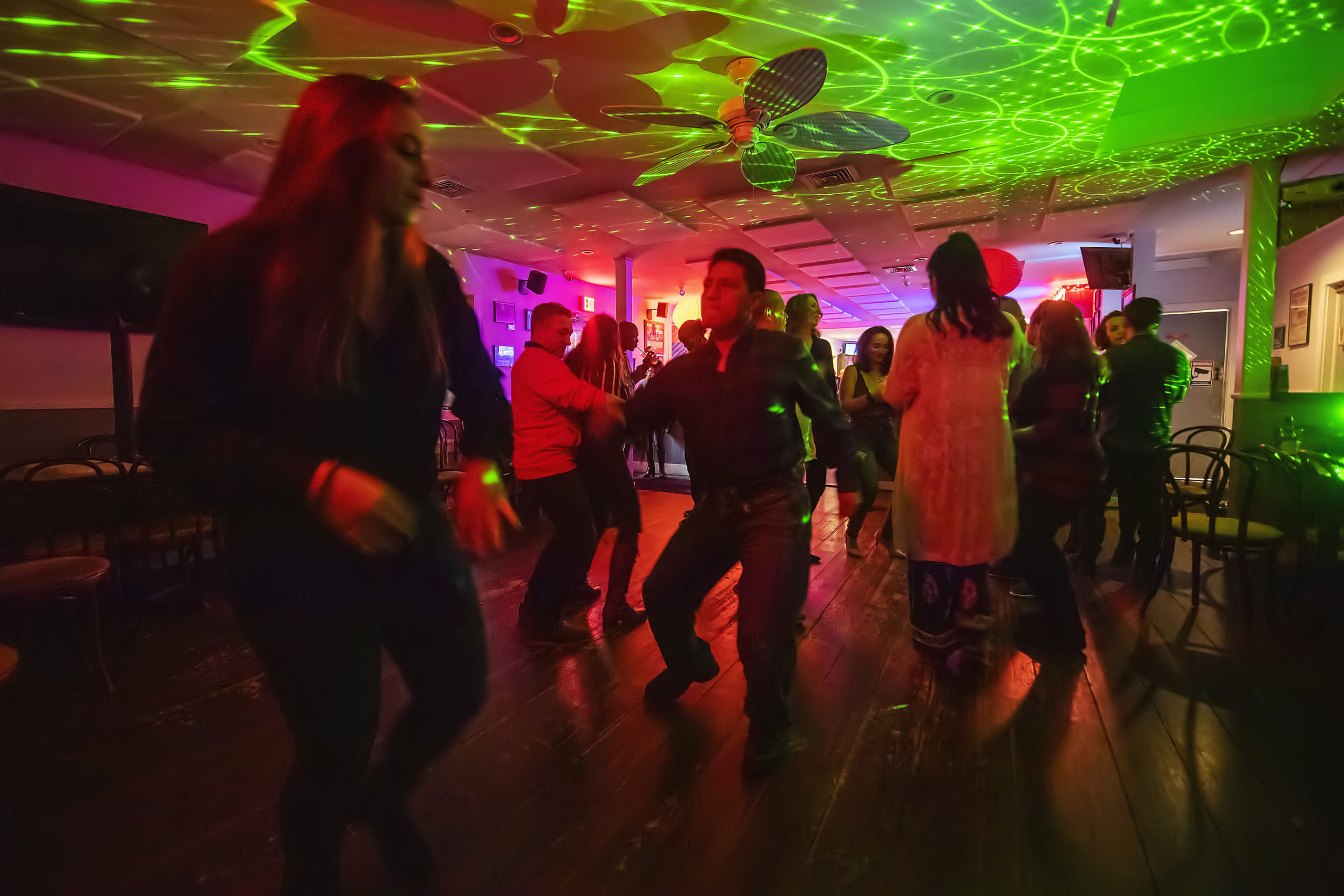 Supporters of ProjectMost on the dance floor during a Salsa Dance Party  at the Springs Tavern on Saturday night, January 25. MICHAEL HELLER