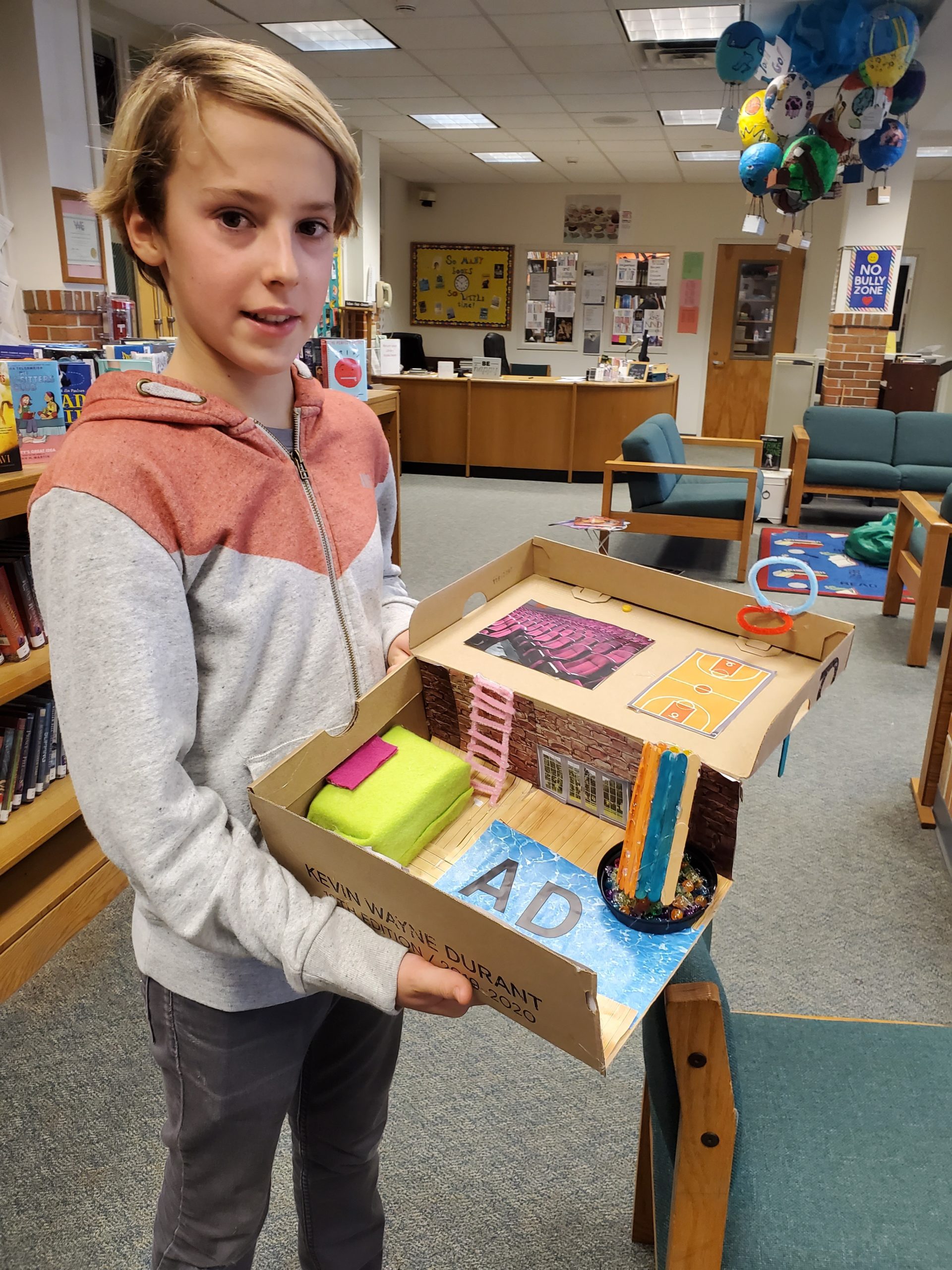 Westhampton Beach Middle School student Adrien Dellaert shows of his design, the result of a project in which students were asked to create their dream bedroom inside a shoebox.