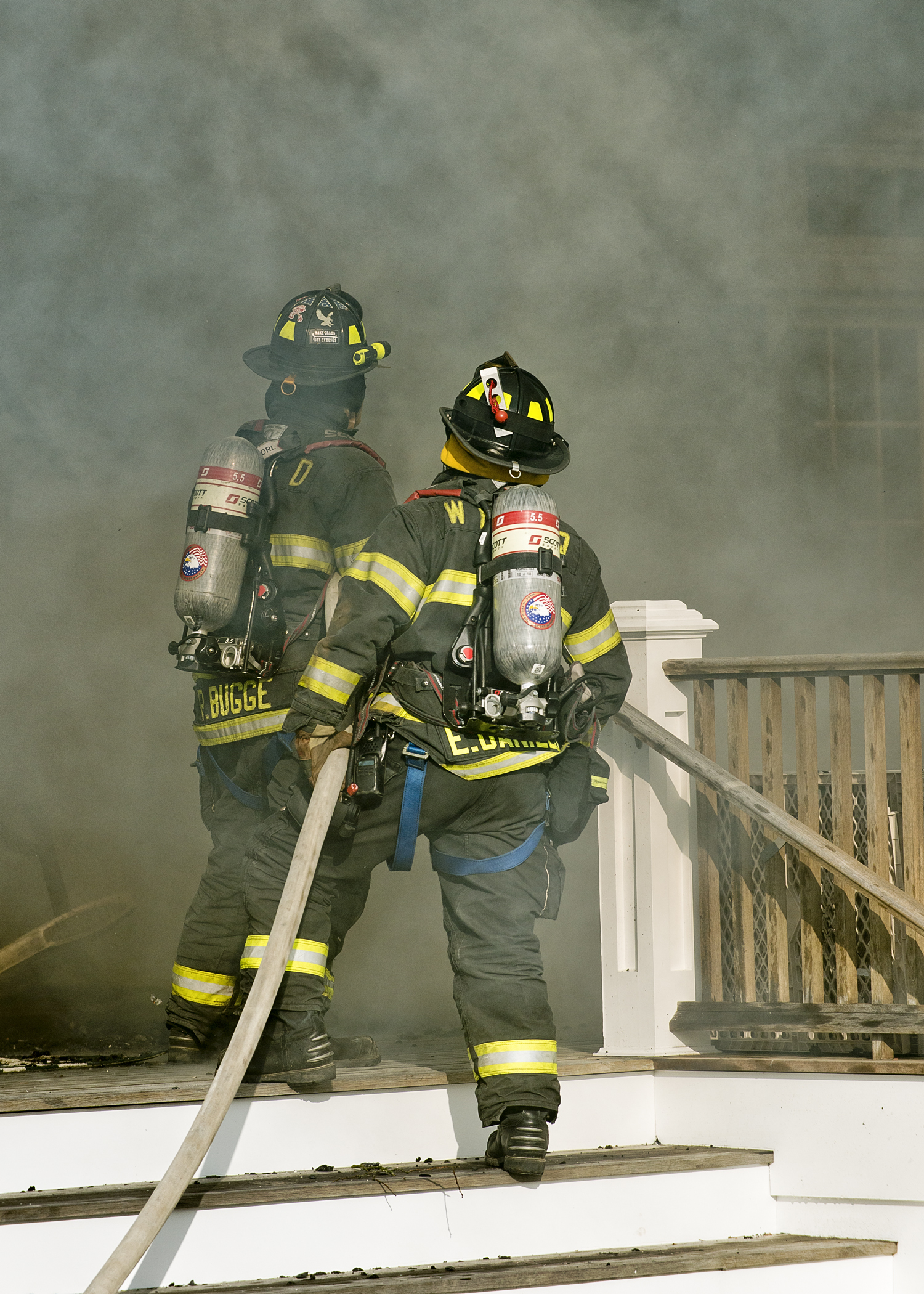 Firefighters atttacking the flames at a home on Michaels Way in Westhampton Beach yesterday afternoon.