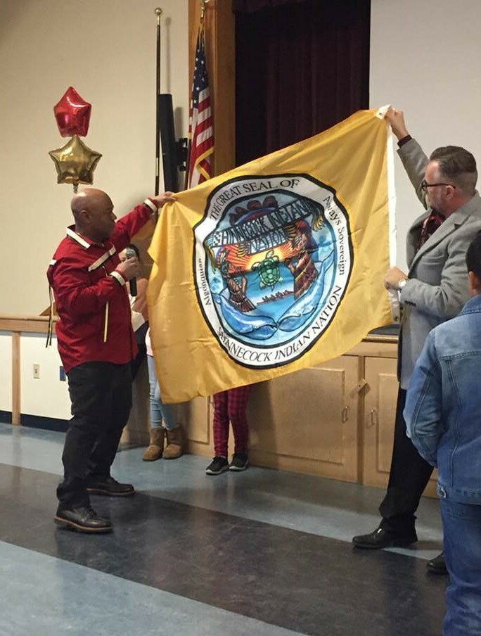 Shinnecock Nation Tribal Trustee Germain Smith  presented the Tuckahoe Common School District with the Shinnecock Nation flag, accepted by Superintendent  Len Skuggevik. The gift was in recognition of the district's 