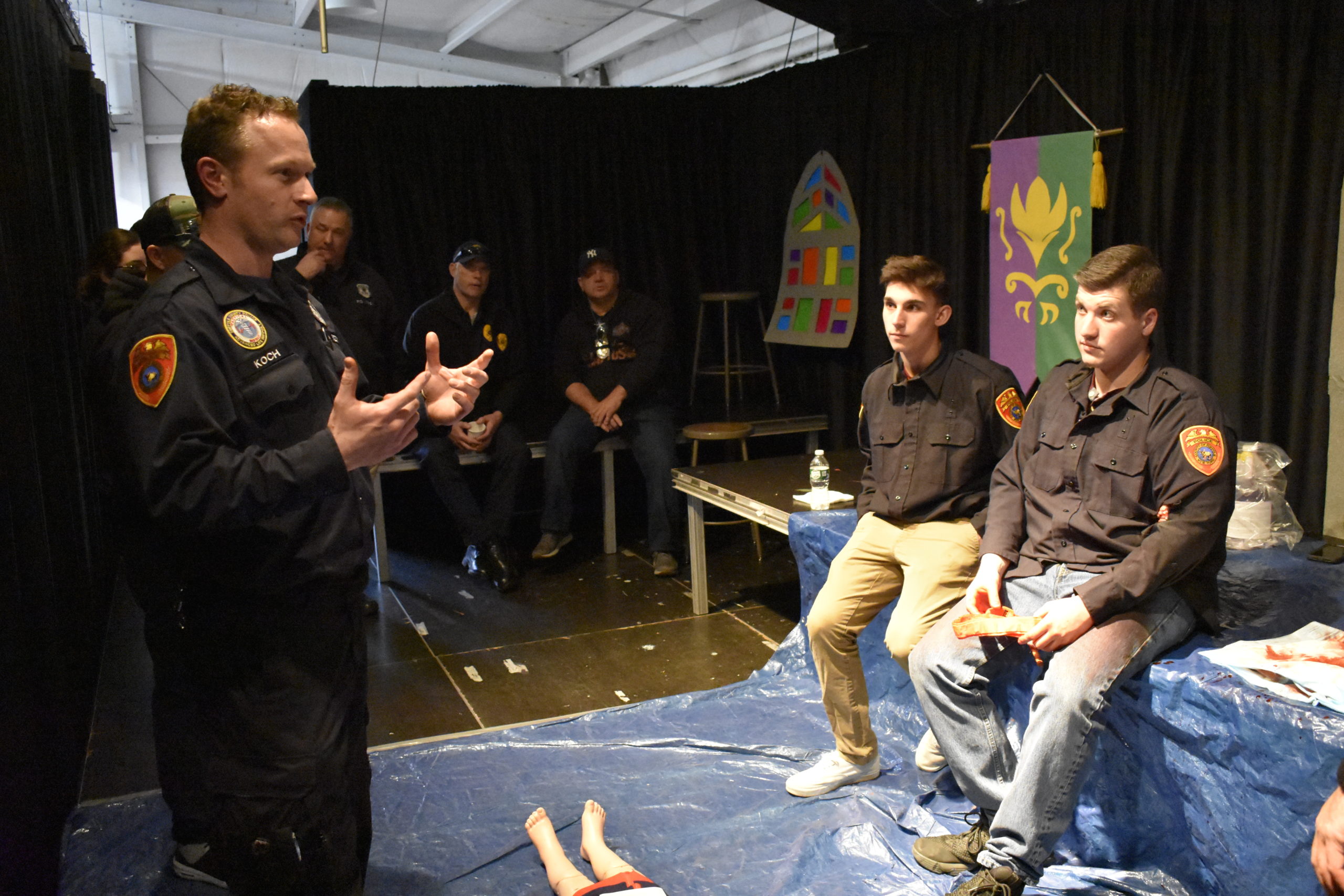 Suffolk County Police MedCAT Officer Brian Koch and police Explorers who participated as crisis actors. 