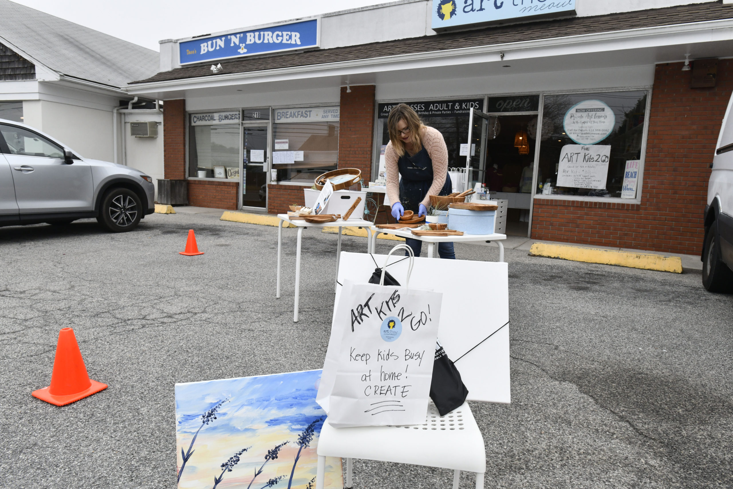 Jaime Booth of Art Thou Meow in Westhampton Beach was selling Art Kits 2 Go in front of her shop on Friday afternoon.   DANA SHAW