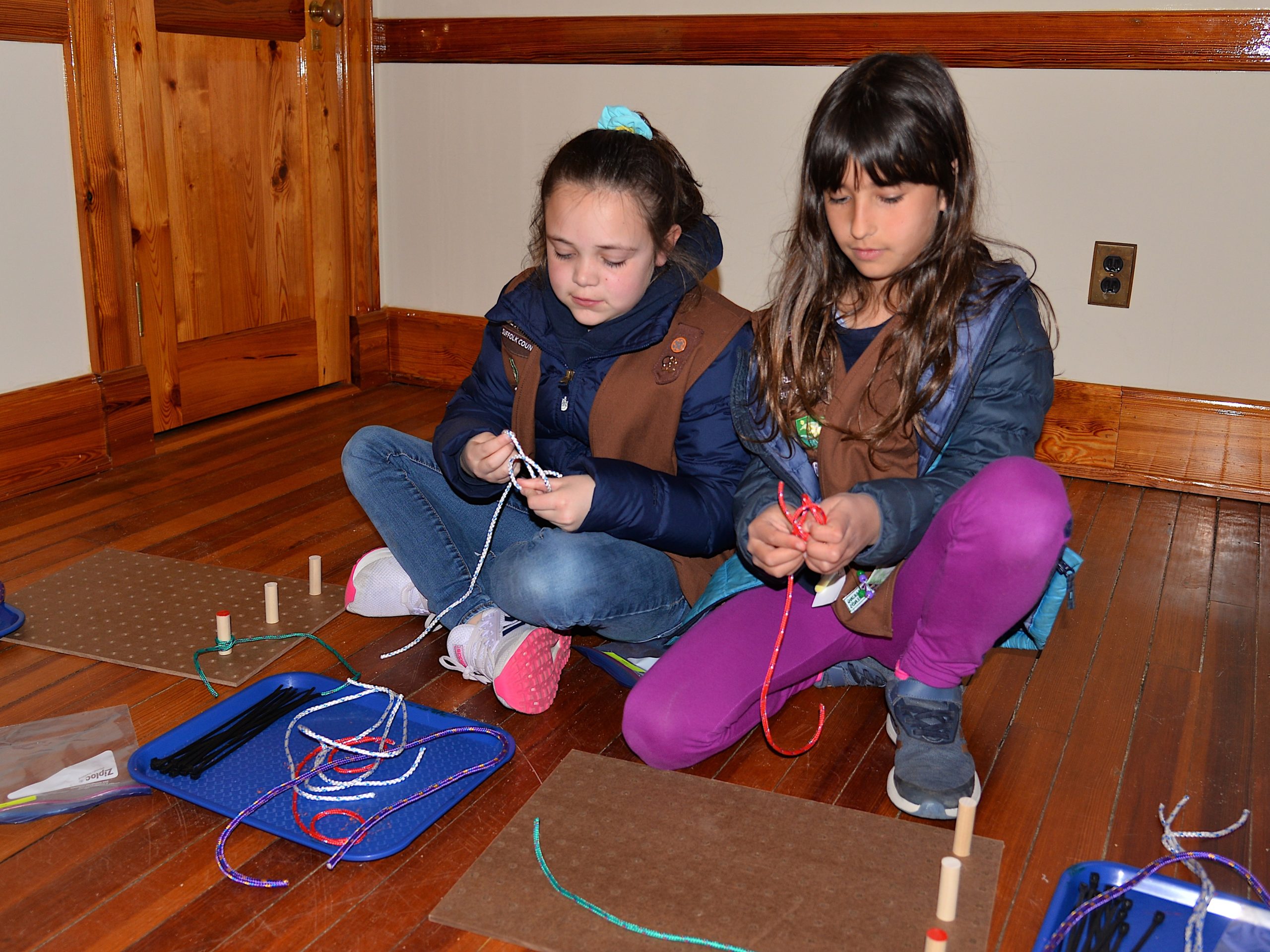 Girl Scouts, including Fallon Centalonza and Pai Bellenoue, learned how to tie knots on Friday at the Amagansett Lifesaving Station, with instructors Britton Bistrian and Stewart Close. 