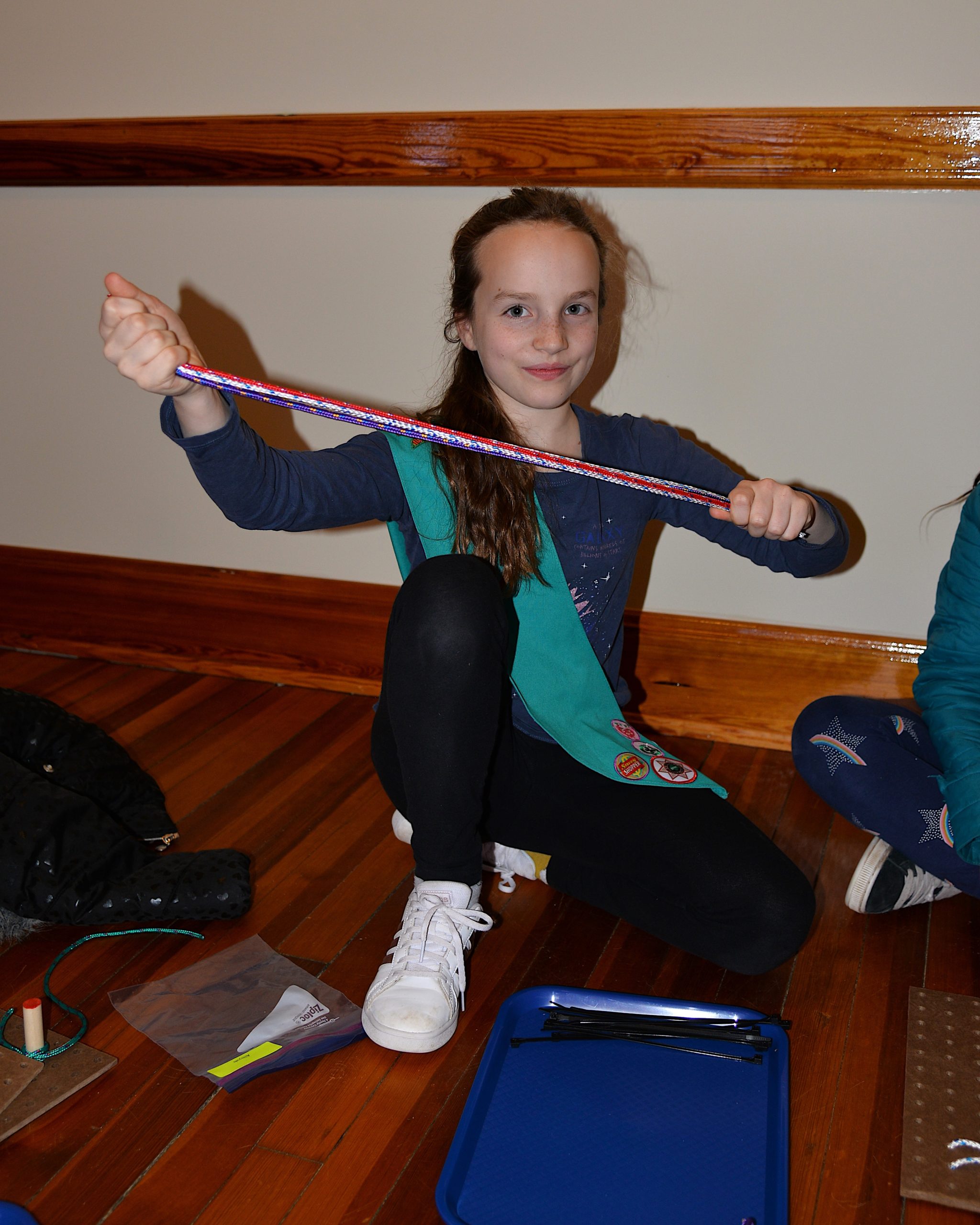 Girl Scouts, including Clemens Emptage, learned how to tie knots on Friday at the Amagansett Lifesaving Station, with instructors Britton Bistrian and Stewart Close. 
