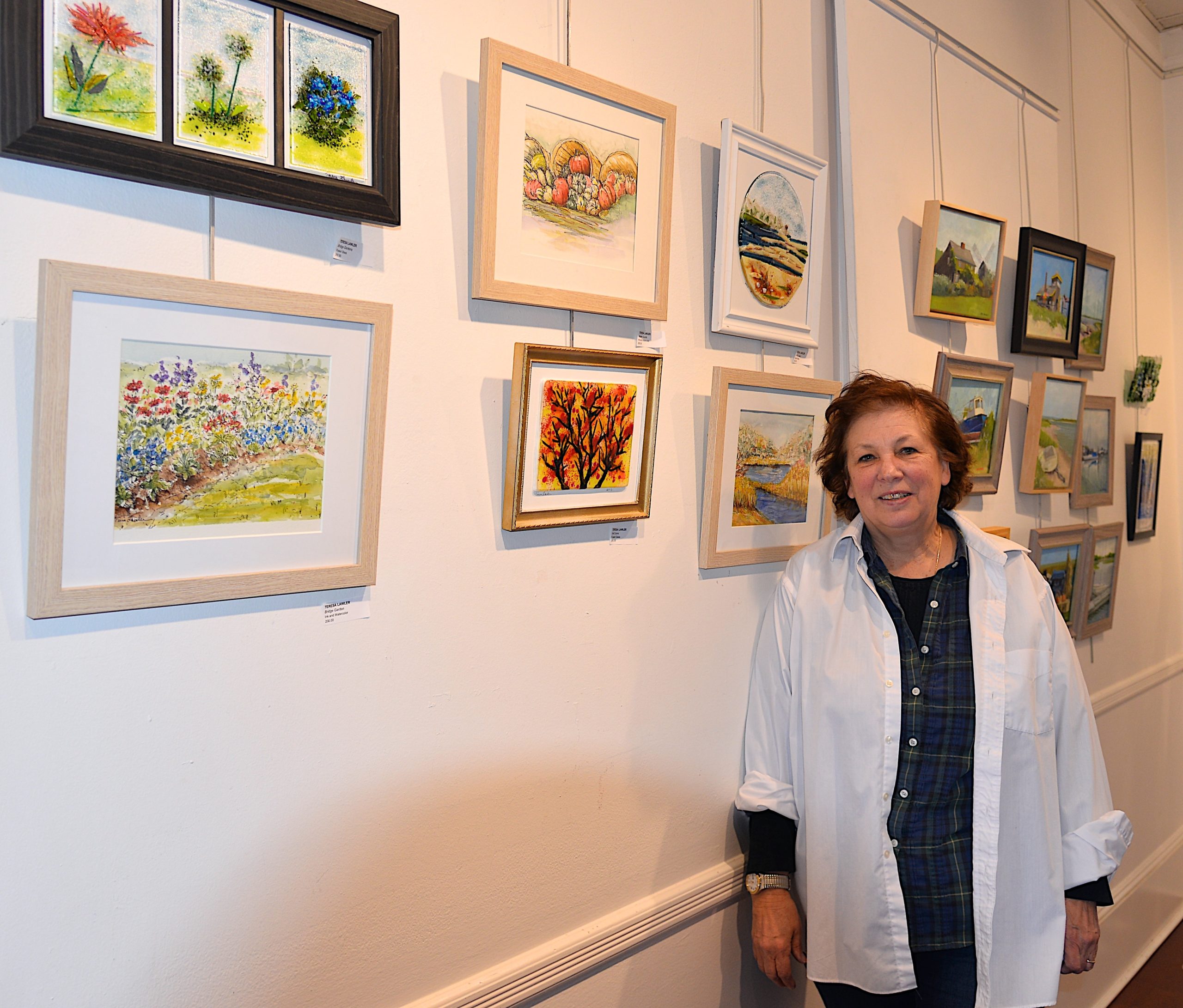 The Artists Alliance of East Hampton held an art exhibit at Ashawagh Hall this weekend, featuring then work of the Wednesday Group, Plein-Air artists using local scenery for inspiration There were also workshops in painting and glass fusion. Teresa Lawler with her artwork.  KYRIL BROMLEY 