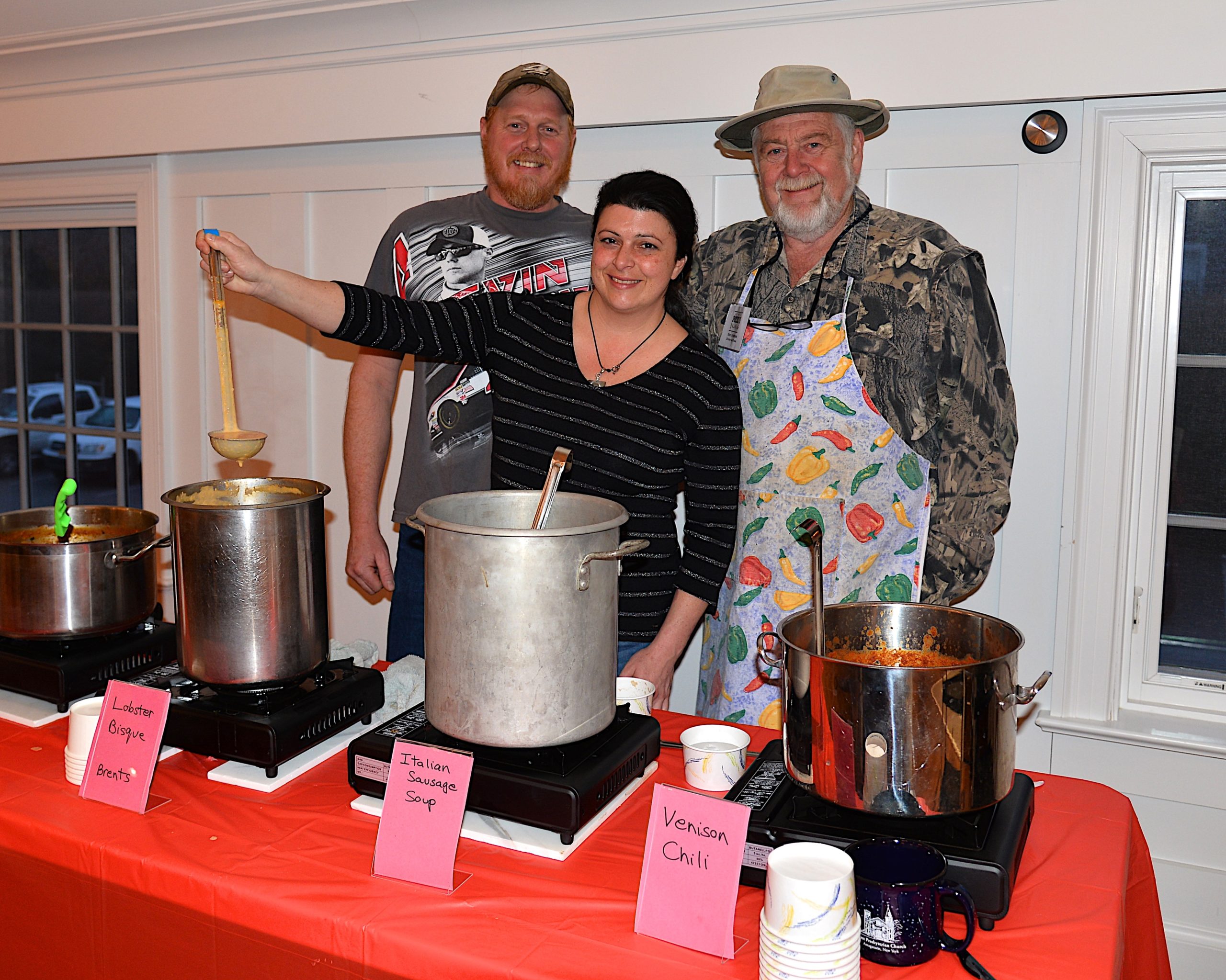 Mark and Diane Hallock, and Terry O’Riordan ready to serve at the Amagansett Presbyterian Church's Soup and Chili dinner on Saturday. KYRIL BROMLEY 