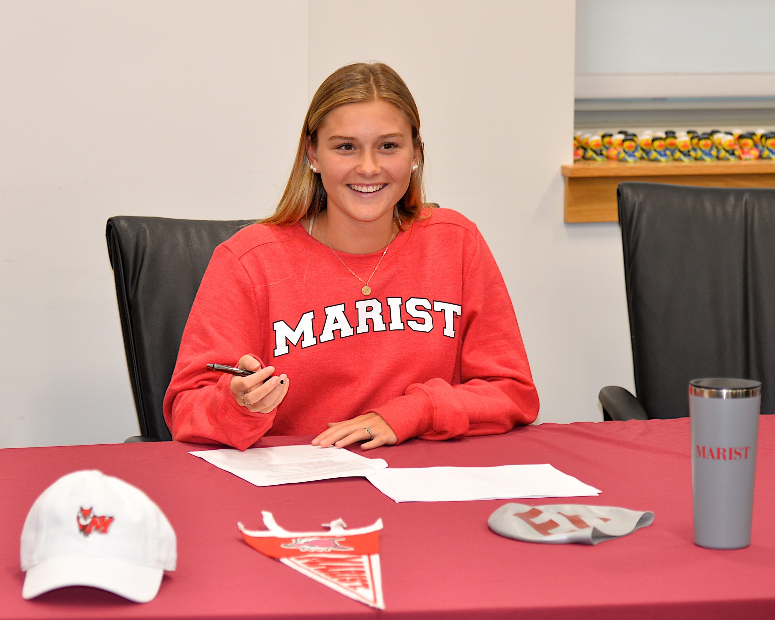 East Hampton senior Sophia Swanson made it official on Tuesday afternoon, committing to Marist College to continue her swim career.