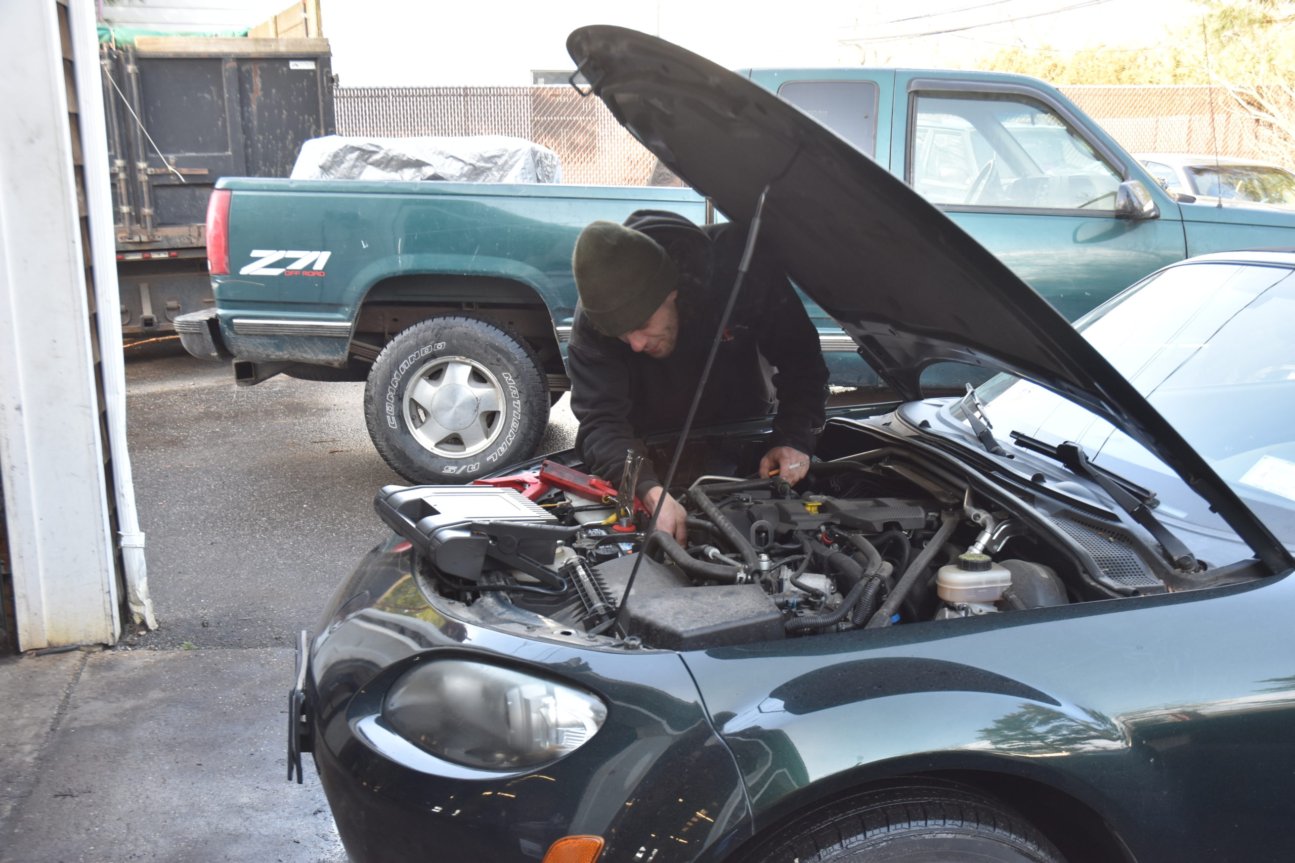Mechanic Brian Damark worked on a car at East Hampton Auto Friday afternoon. STEPHEN J. KOTZ