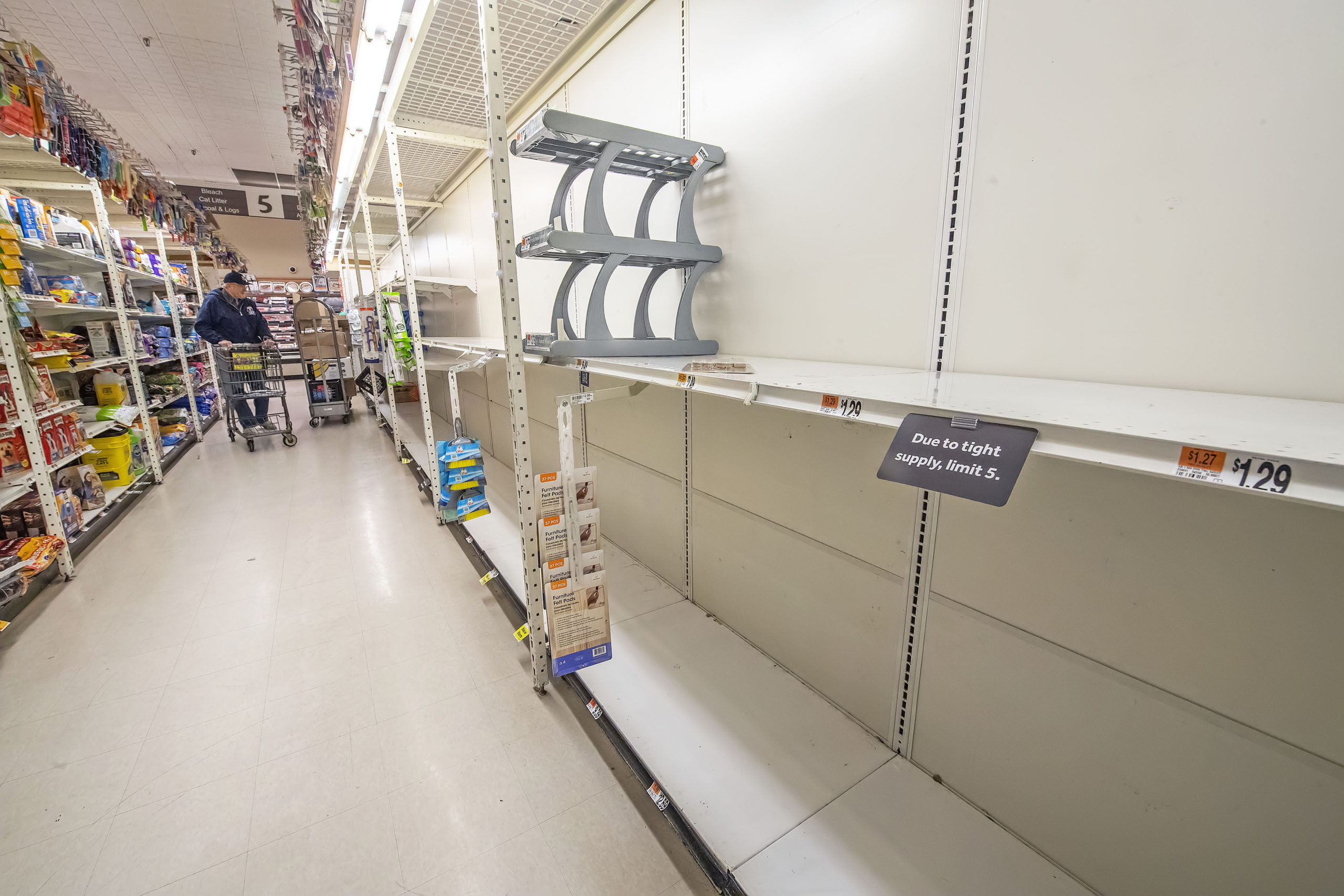 Empty shelves where toilet paper would normally be in the East Hampton Stop & Shop supermarket on Friday afternoon.  MICHAEL HELLER