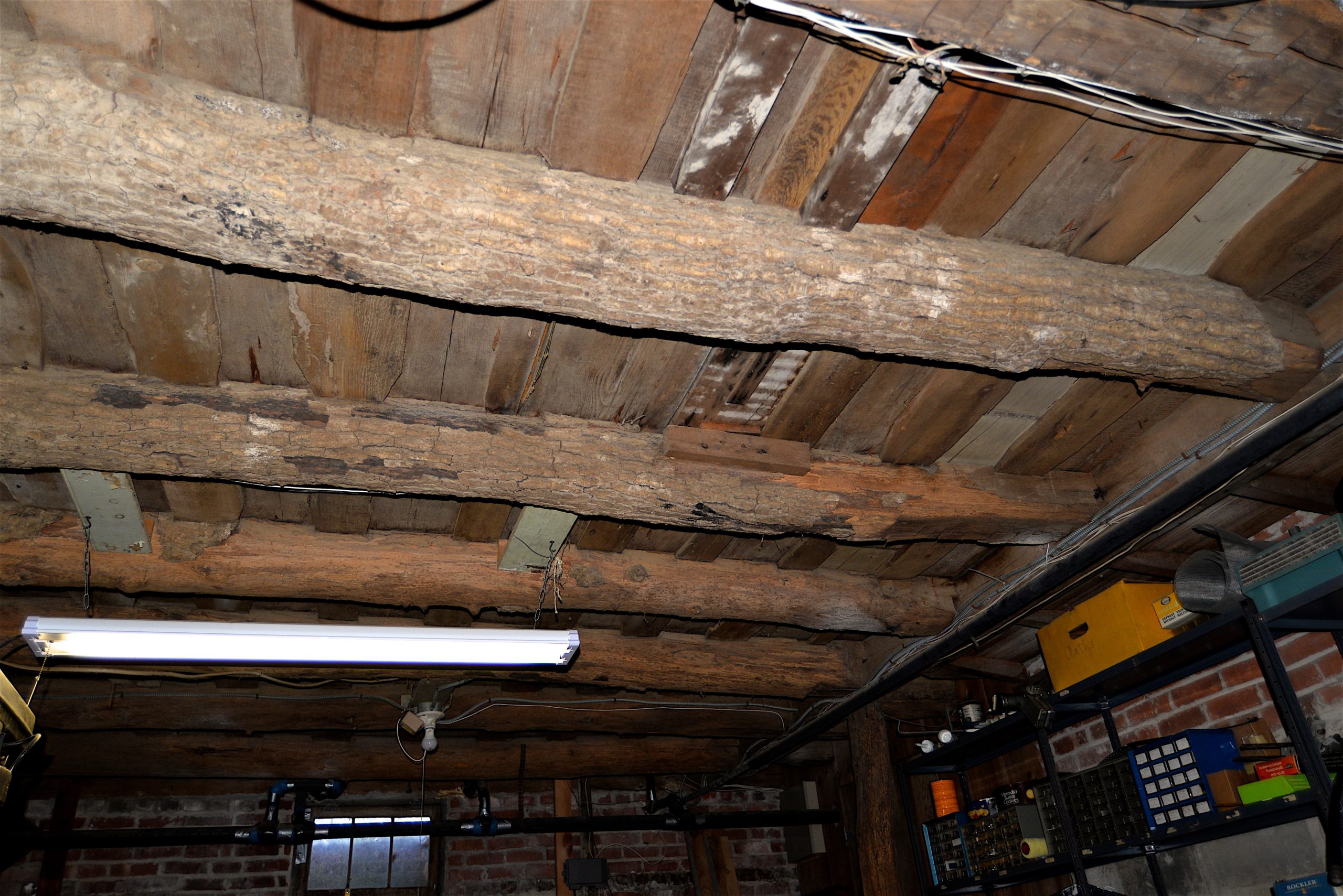 Ax-hewn beams in the basement of the Fithian House. 
