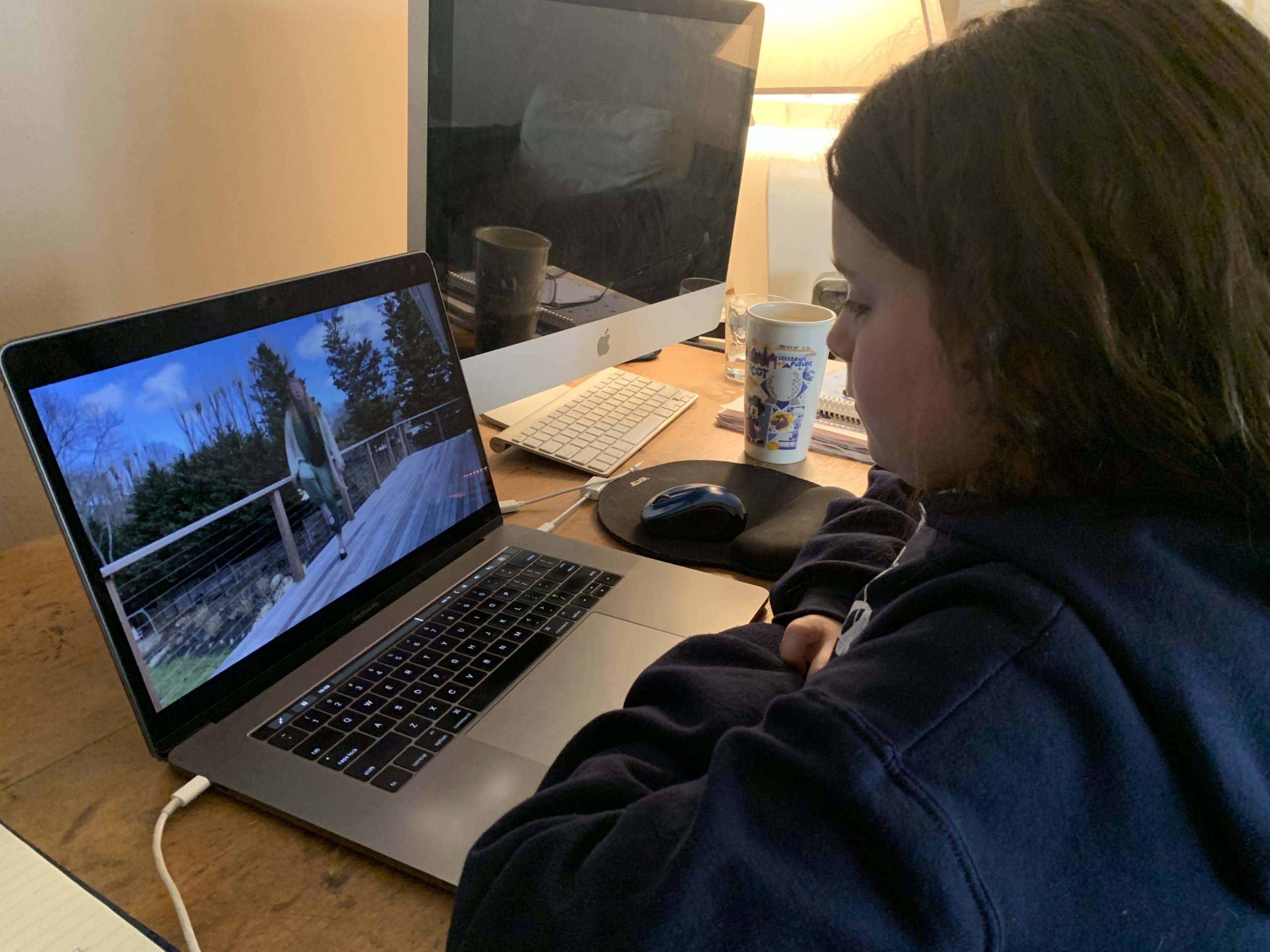 Former Sag Harbor Elementary student Ella Menu takes in a virtual Morning Program. 