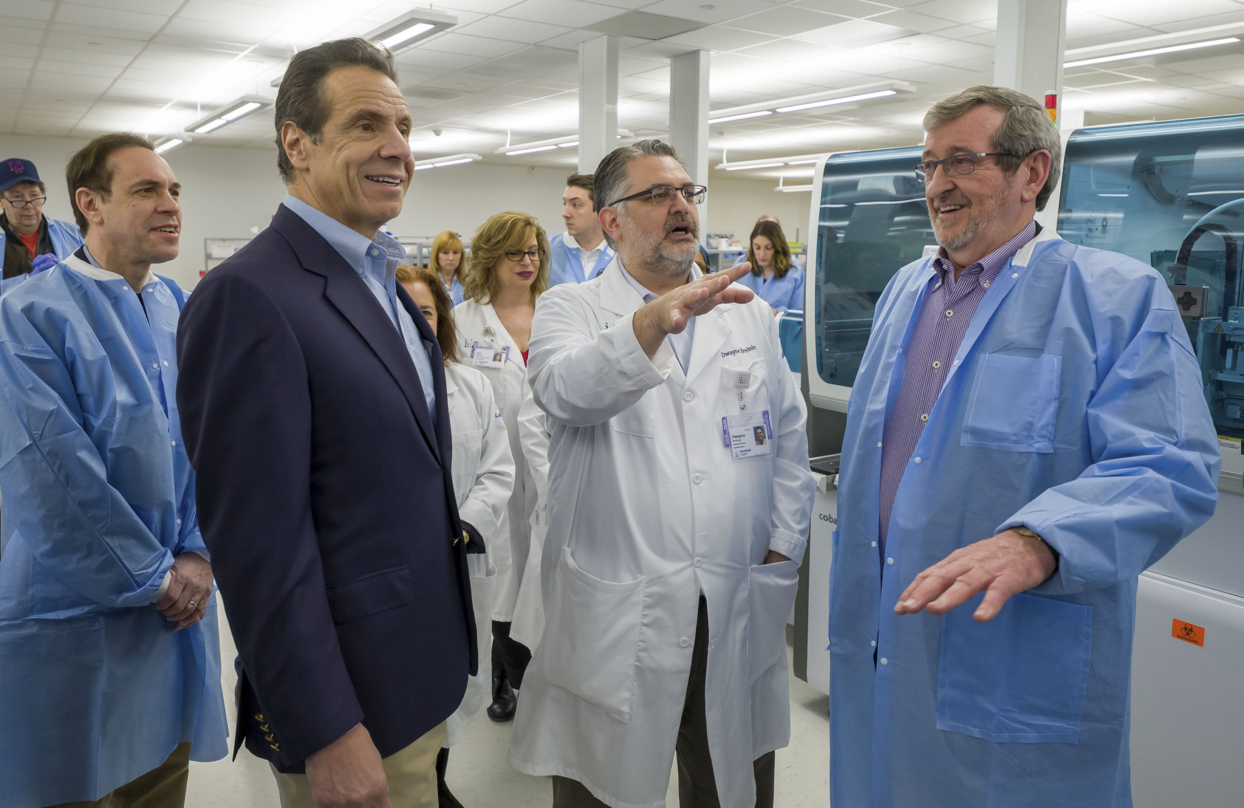 New York State Commissioner of Health Howard Zucker, Governor Andrew Cuomo, Dr. Dwayne Breining and Northwell President and CEO Michael Dowling tour Northwell Health Labs in Lake Success, NY, on Sunday. COURTESY NORTHWELL HEALTH