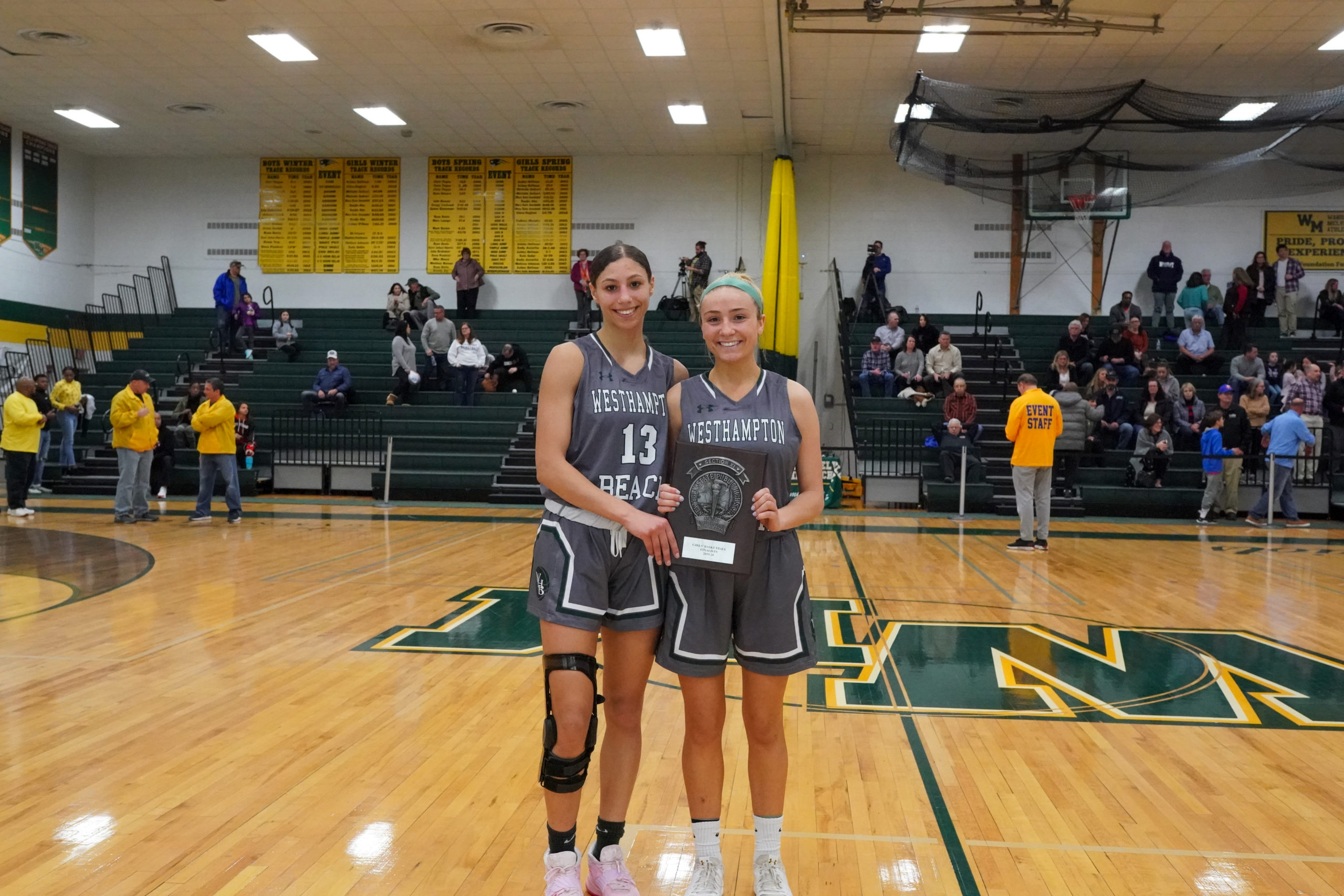 Lady 'Canes Layla Mendoza, left, and Isabelle Smith with the team's Section XI finalists plaque.