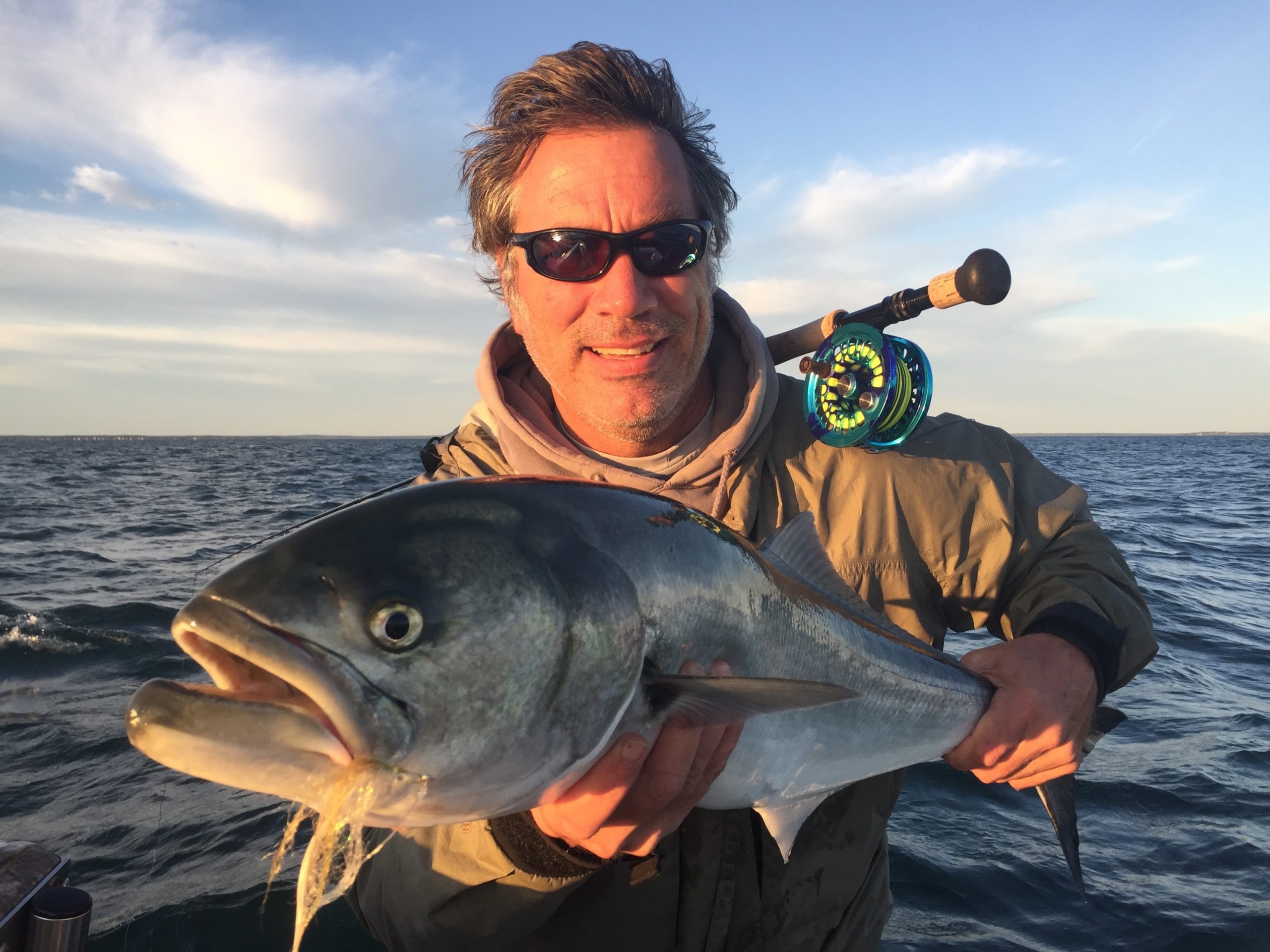 You may be able to get this close to a fish this coming season, but you probably won't be able to get this close to another angler. Todd Richter with a big fly-caught bluefish from last season. 