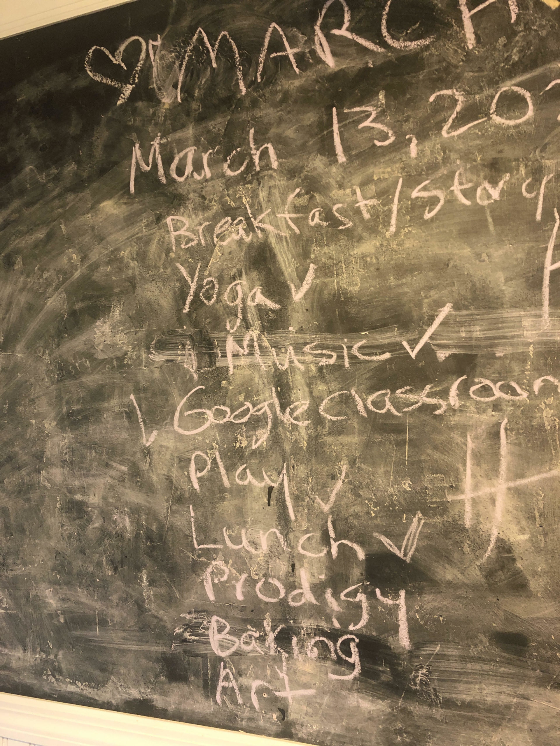 The chalkboard in Emily Weitz and Christian McLean's Sag Harbor home outlines the class schedule for March 13. 