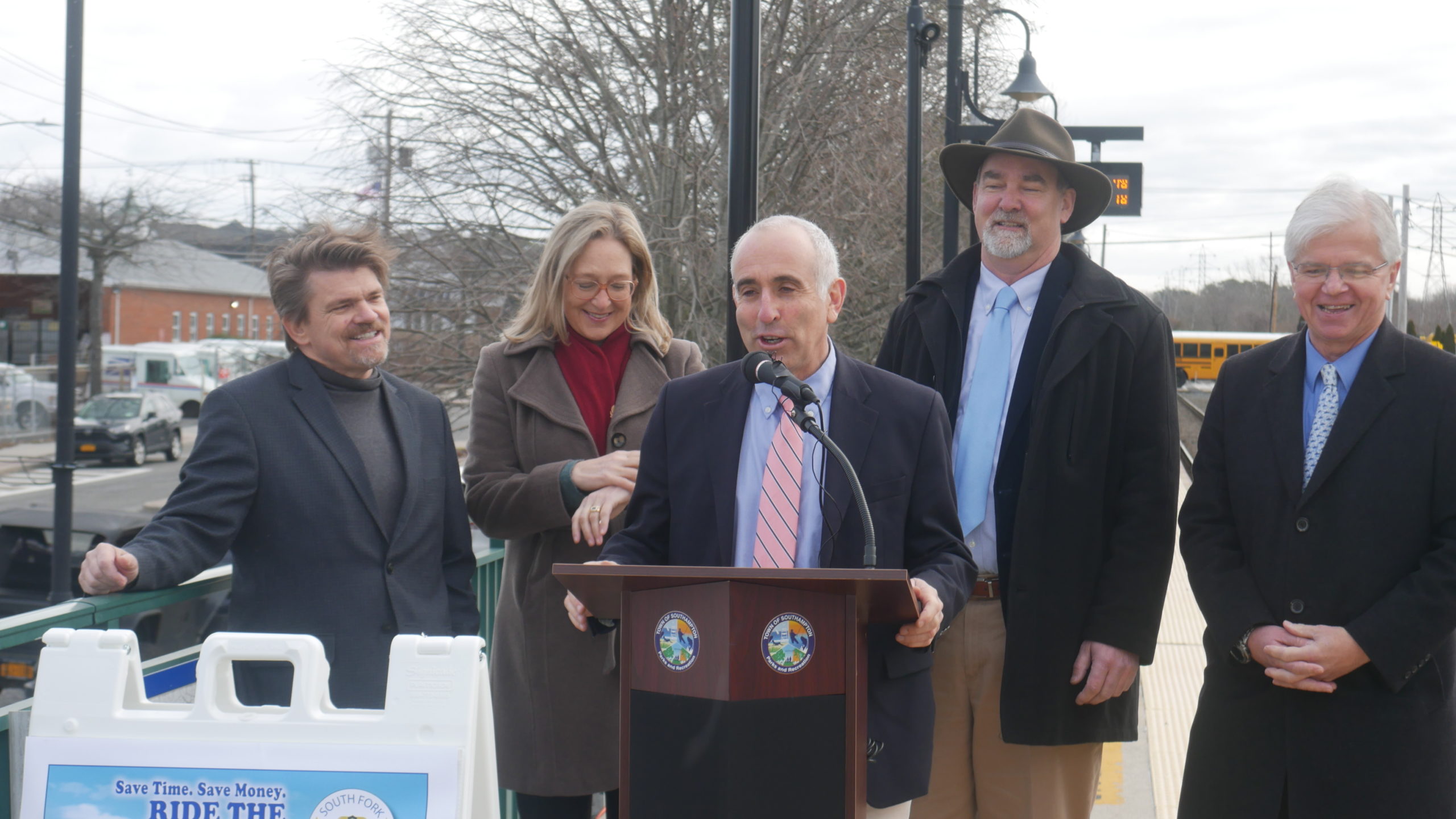 State Assemblyman Fred W. Thiele Jr. discusses the success of the South Fork Commuter Connection as Southampton Town Councilman Tommy John Schiavoni, Suffolk County Legislator Bridget Fleming, East Hampton Town Supervisor Peter Van Scoyoc, and Southampton Town Supervisor Jay Schneiderman look on. CONNIE CONWAY