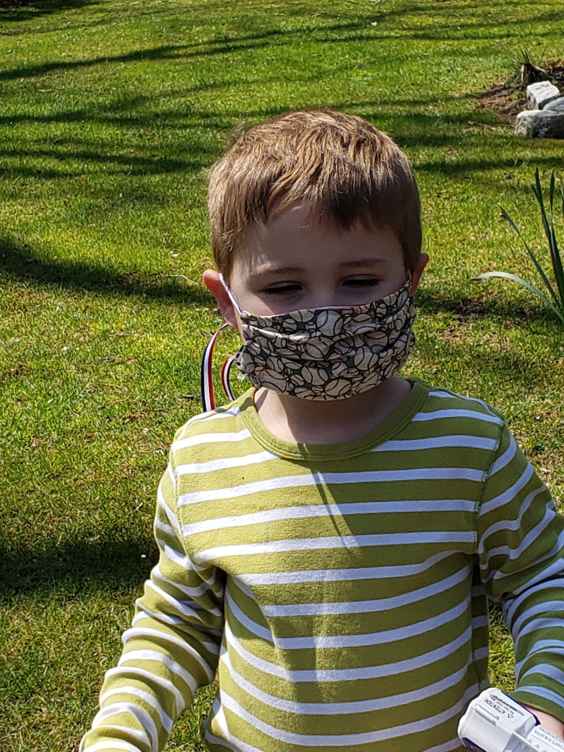 Patrick Eberhart of Springs with a mask crafted by his 