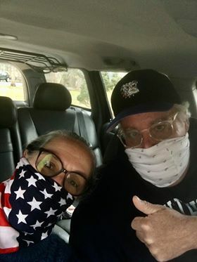 Patty and Tony Sales of East Hampton out delivering cookies and homemade masks Patty crafted. 