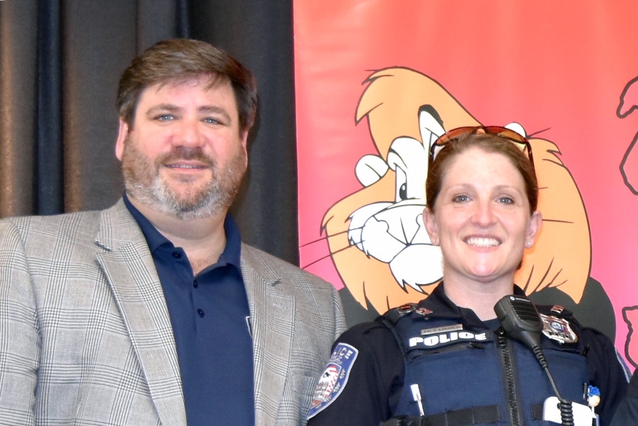 Village Board member Rich Yastrzemski with Police Officer Tiffany Lubold at last year's DARE graduation. He focused his comments on enforcement response to the COVID-19 crisis.