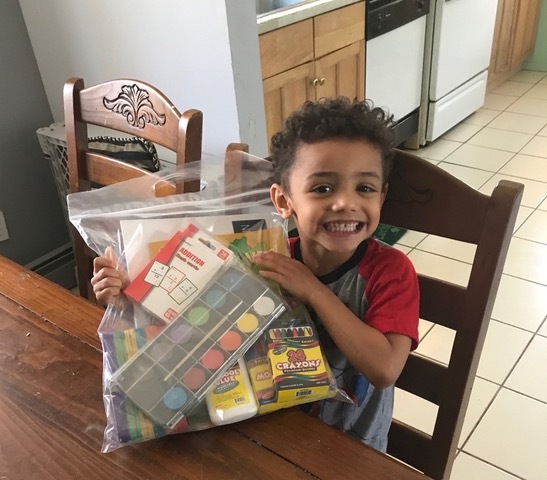 Dylan of Riverhead is so excited to receive a CareKit.