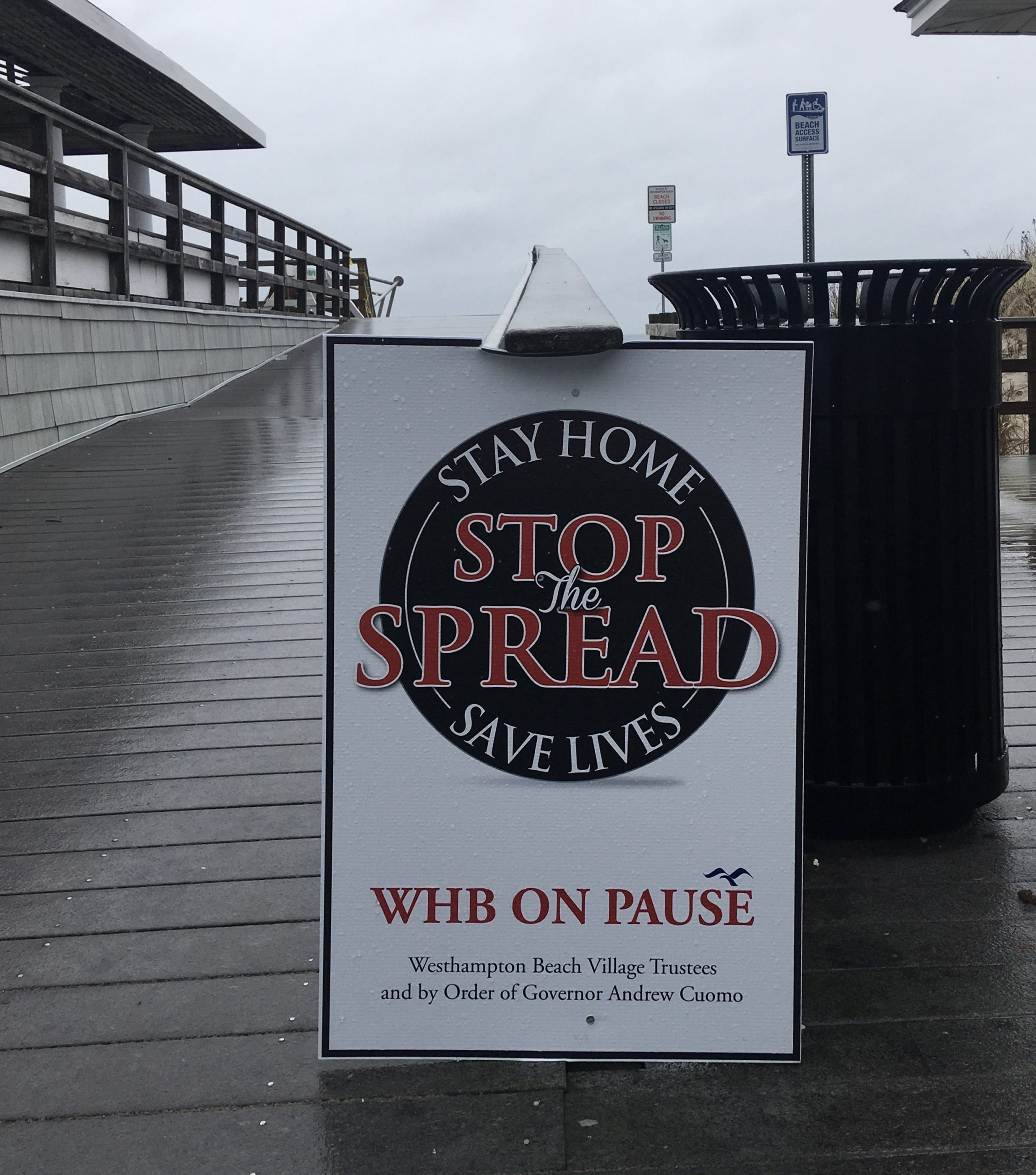 In the Village of Westhampton Beach, signs encourage visitors to the beaches and parks to comply with the New York PAUSE order. 
