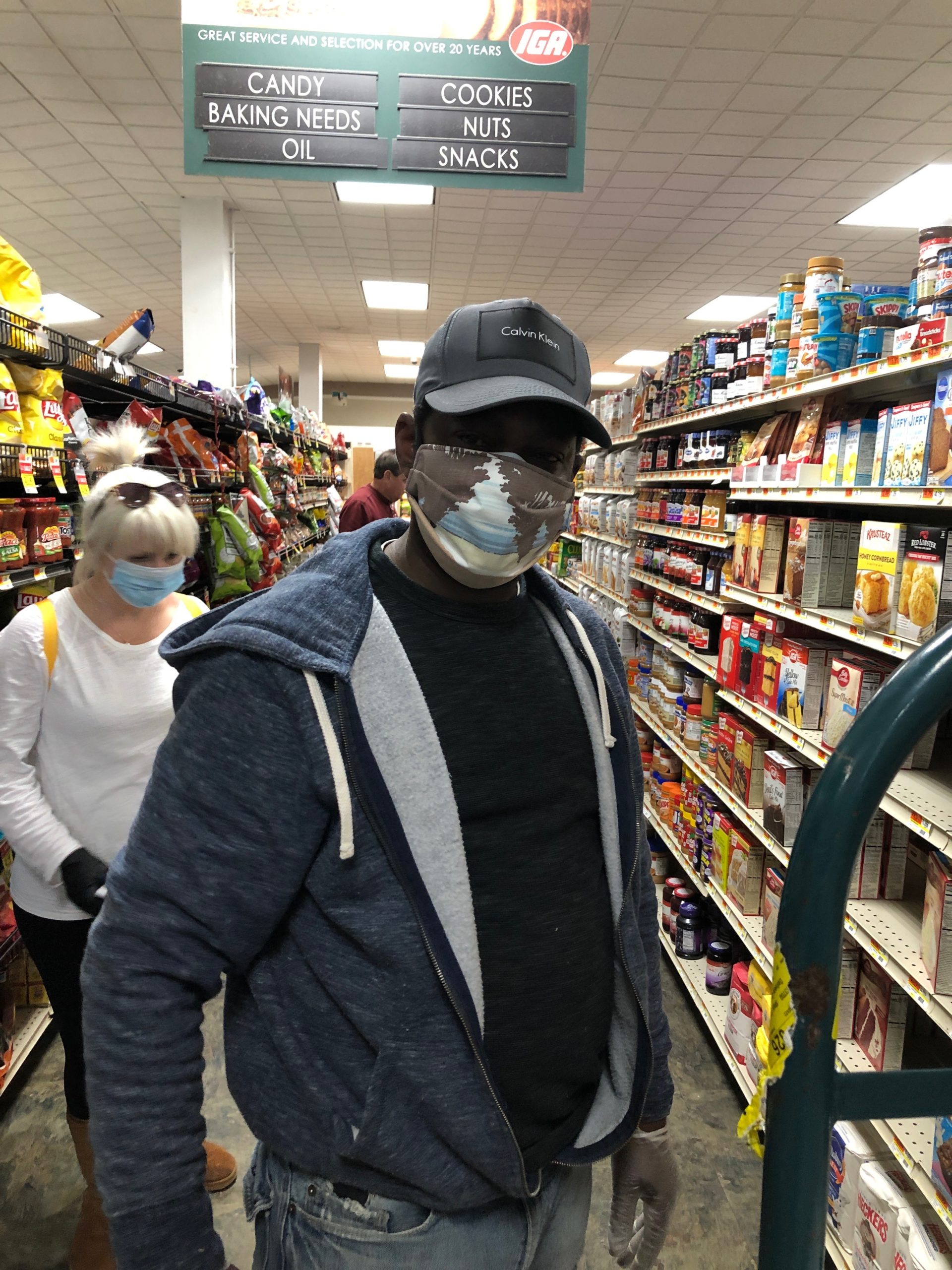 Ricky, a longtime employee of the Montauk IGA wearing one of 20 masks that East End Cares delivered to the grocery store to protect its employees who are working to stock shelves despite the threat of coronavirus. 