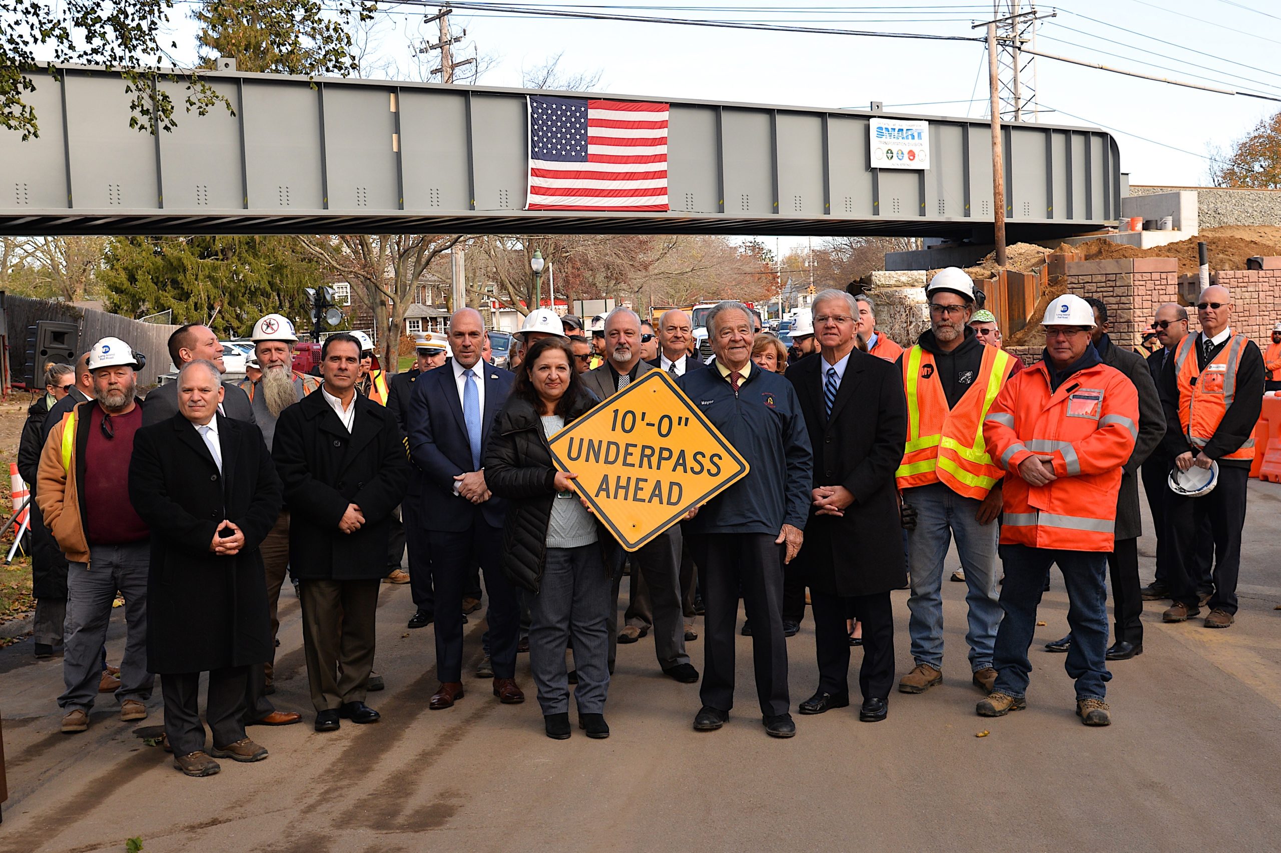 Officials from the LIRR and Esat Hampton Village celebrated in November when the new, higher, trestles were completed. But the influx of large trucks using the roadways between the two new trestles has caused other concerns. 