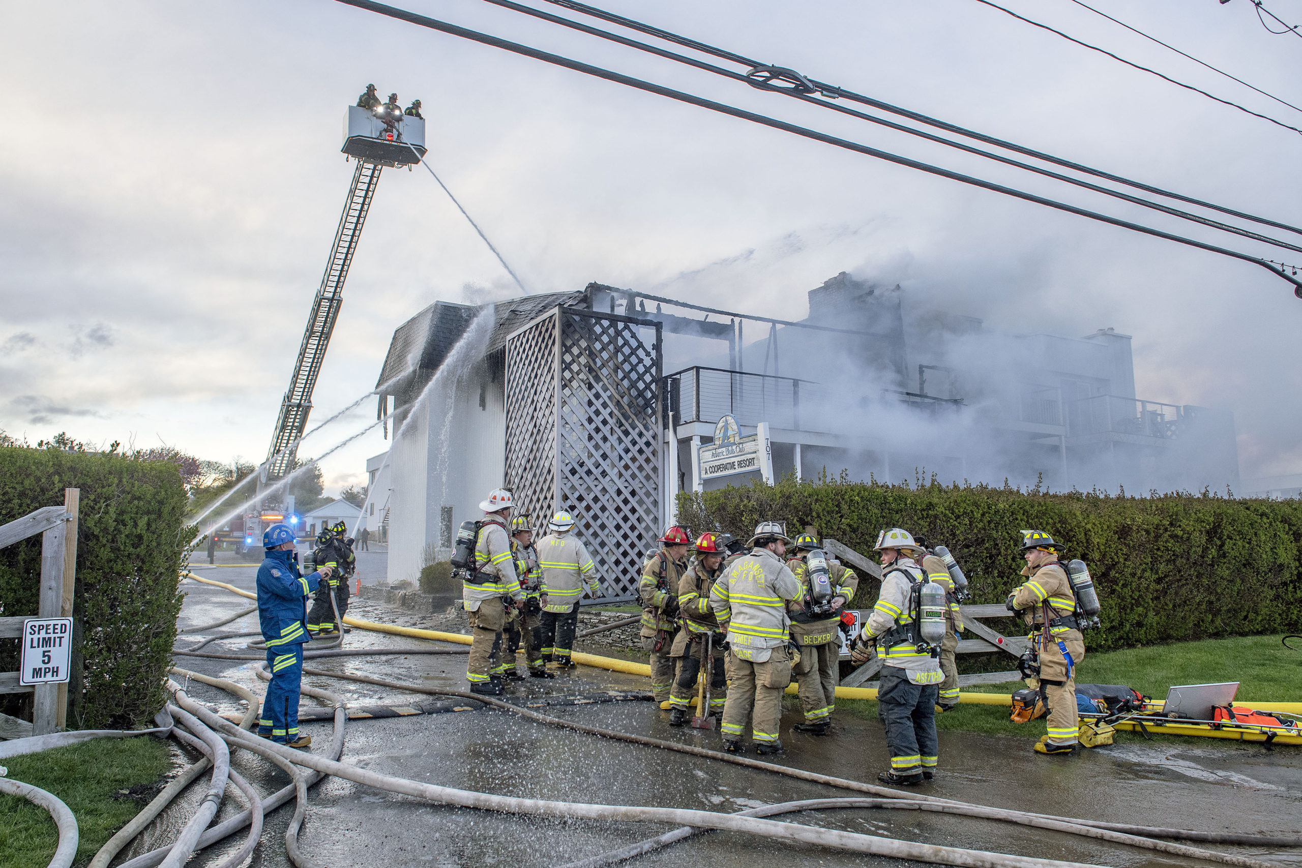 Members of the Montauk, Amagansett and East Hampton Fire Departments battled a working fire at the Atlantic Bluffs Condominiums at 707 Old Montauk Highway on Saturday night.  MICHAEL HELLER