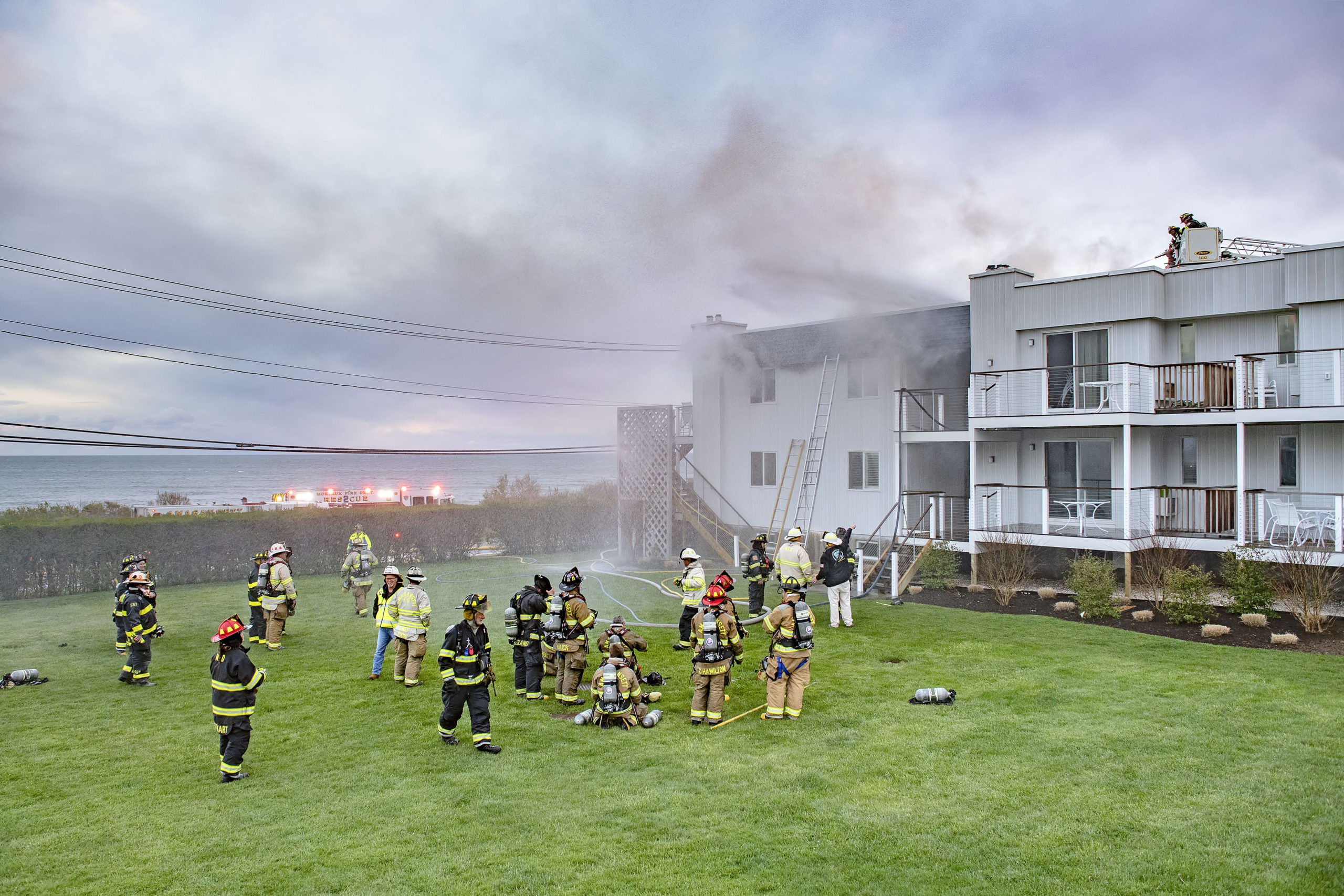 Members of the Montauk, Amagansett and East Hampton Fire Departments battled a working fire at the Atlantic Bluffs Condominiums at 707 Old Montauk Highway on Saturday night.    MICHAEL HELLER